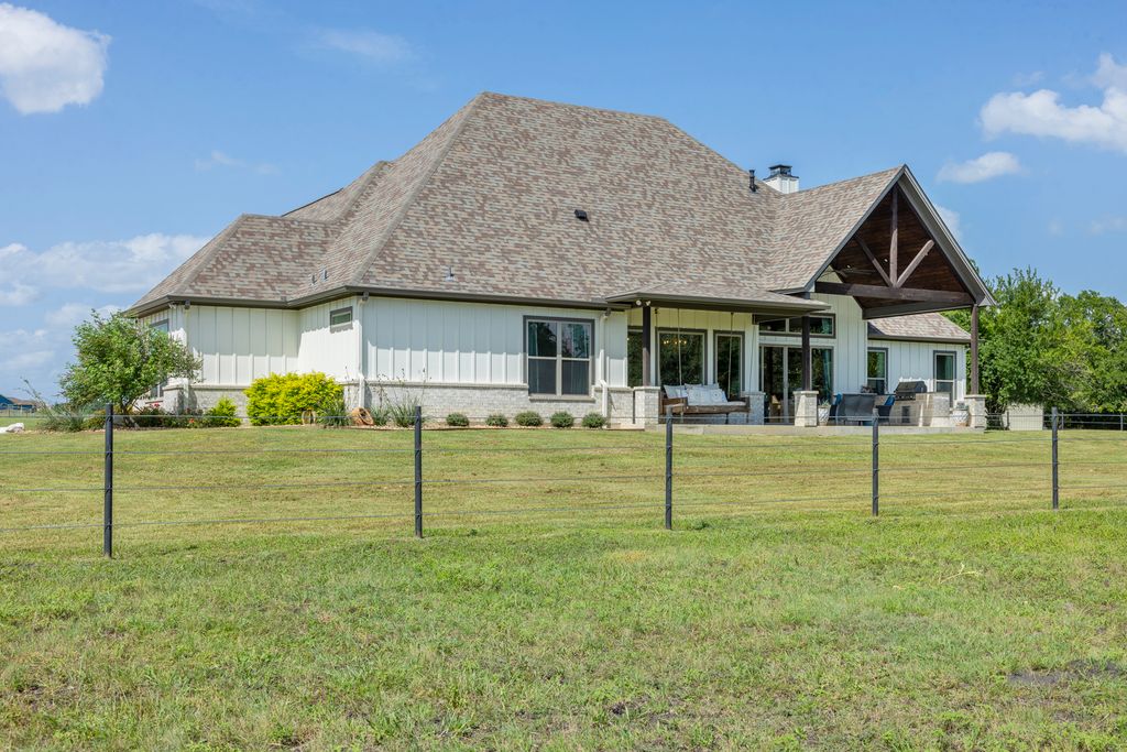 7650 Rolling Creek Road Burton, TX 77835 - Photo 21 of 22 a front view of a house with a yard