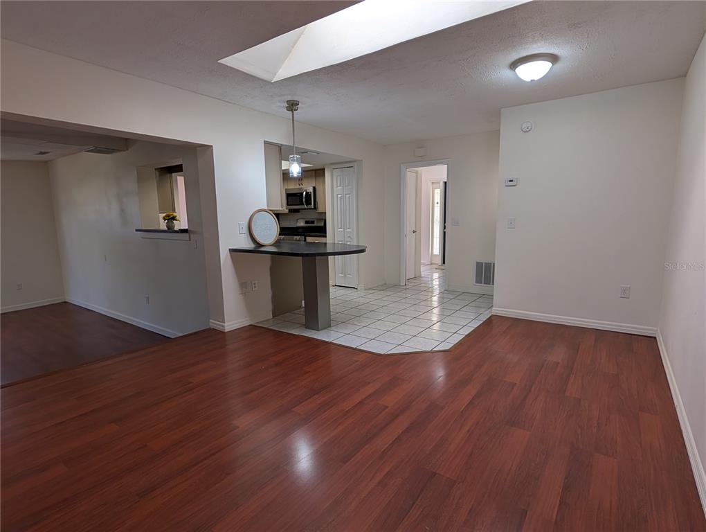 627 Prairie Lane Altamonte Springs, FL 32714 - Photo 11 of 32 a view of empty room with wooden floor