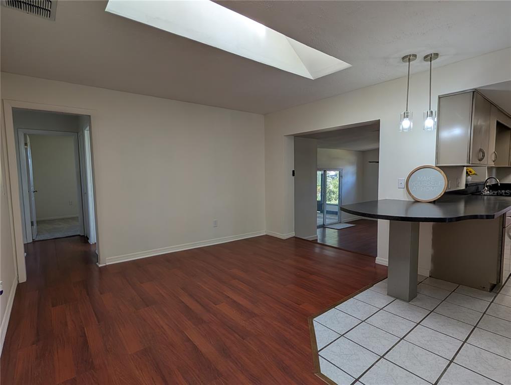627 Prairie Lane Altamonte Springs, FL 32714 - Photo 12 of 32 a view of kitchen and hall with wooden floor