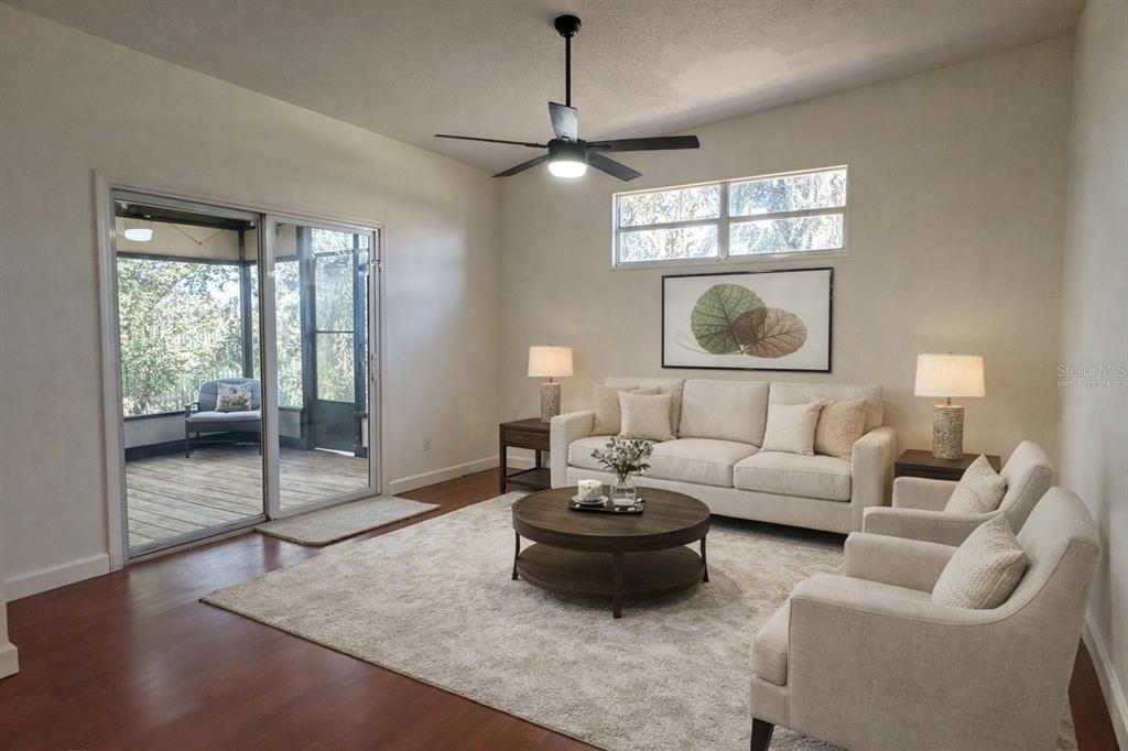 627 Prairie Lane Altamonte Springs, FL 32714 - Photo 15 of 32 a living room with furniture and a chandelier