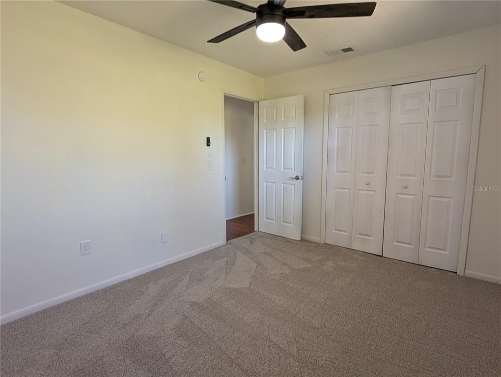 627 Prairie Lane Altamonte Springs, FL 32714 - Photo 20 of 32 an empty room with a ceiling fan and a window