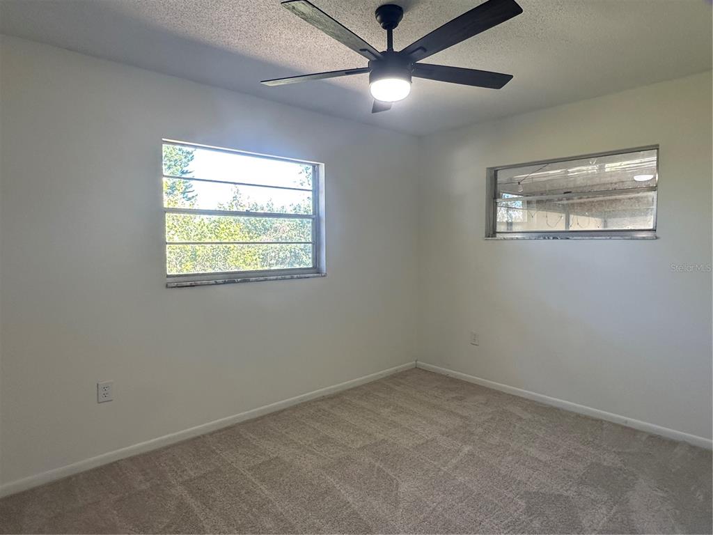 627 Prairie Lane Altamonte Springs, FL 32714 - Photo 21 of 32 an empty room with a window and a fan