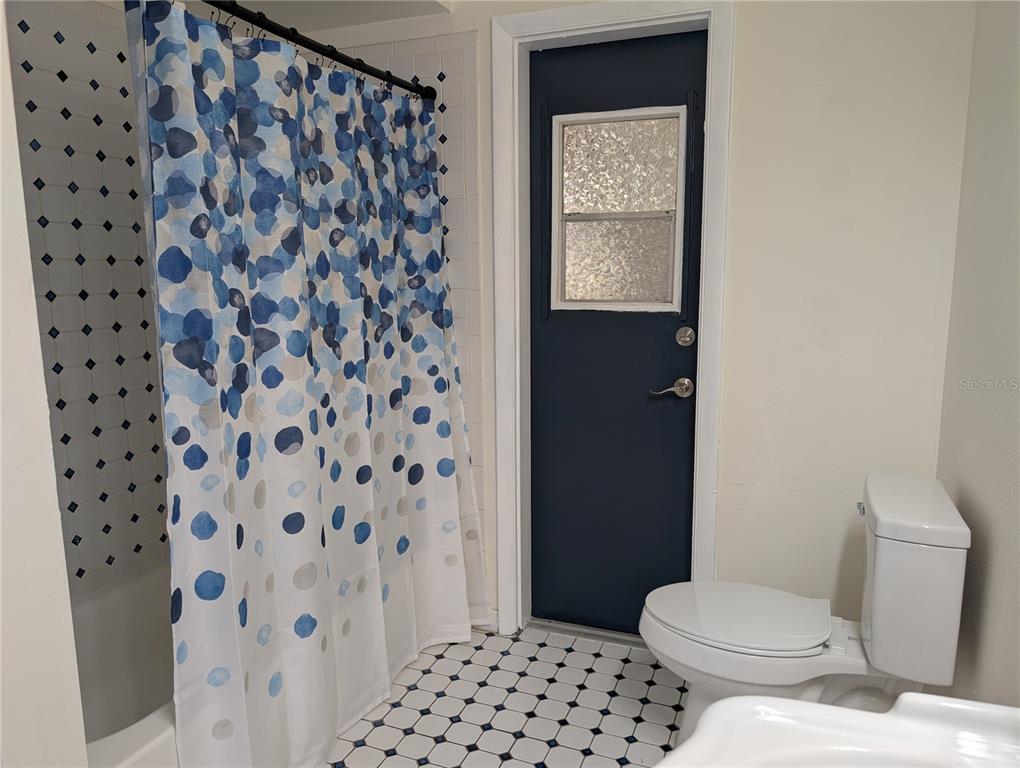 627 Prairie Lane Altamonte Springs, FL 32714 - Photo 25 of 32 a white toilet sitting next to a bathroom sink