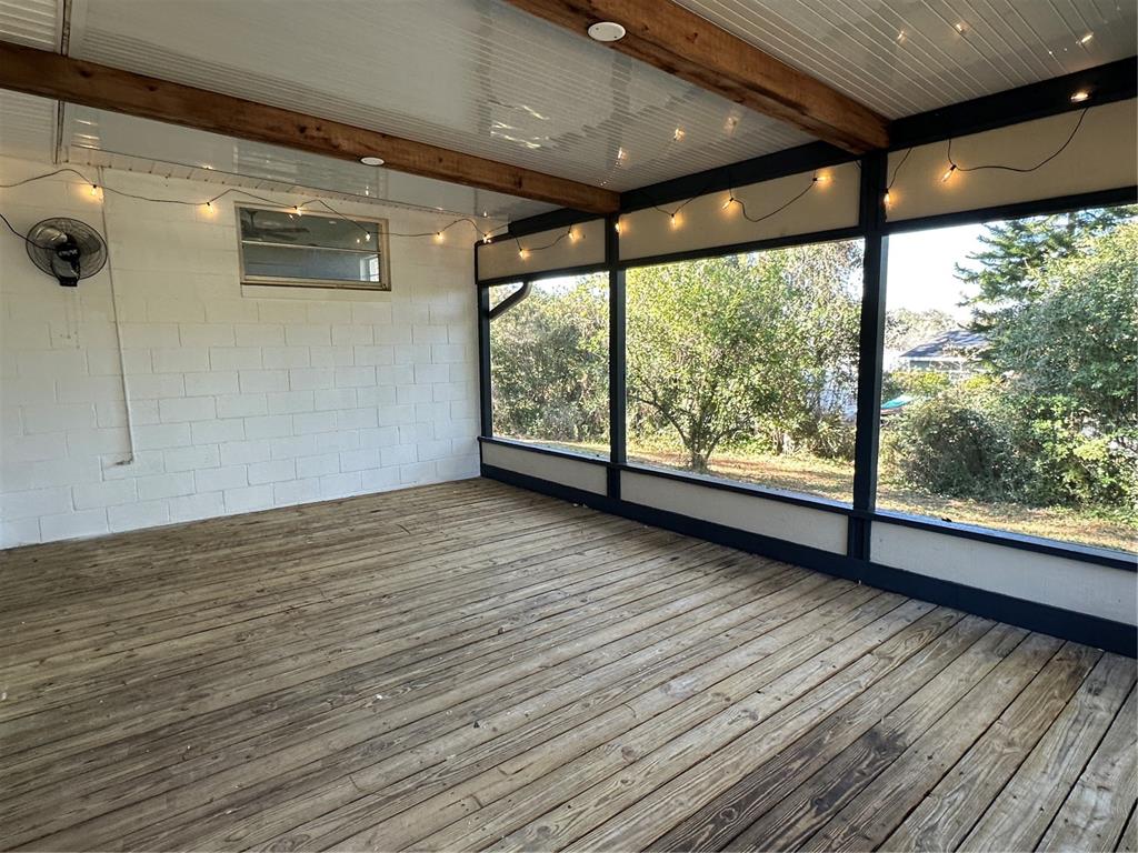 627 Prairie Lane Altamonte Springs, FL 32714 - Photo 27 of 32 an empty room with wooden floor and windows