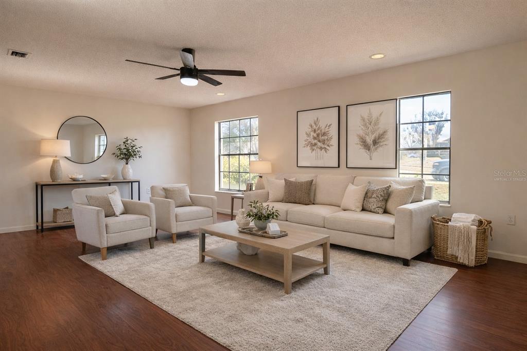 627 Prairie Lane Altamonte Springs, FL 32714 - Photo 5 of 32 a living room with furniture and a large window