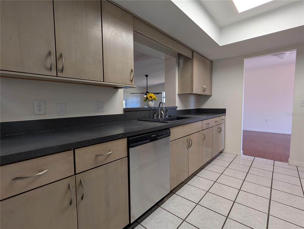 627 Prairie Lane Altamonte Springs, FL 32714 - Photo 9 of 32 a kitchen with stainless steel appliances granite countertop a sink a stove cabinets and granite counter top