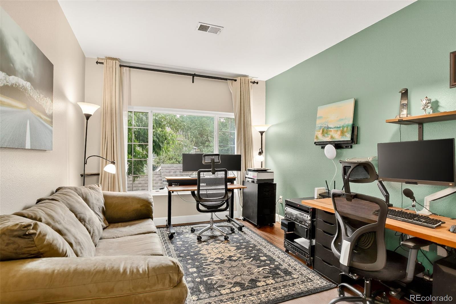 8415 Pebble Creek Way, Unit 203 Highlands Ranch, CO 80126 - Photo 20 of 36 a view of a livingroom with workspace and a window
