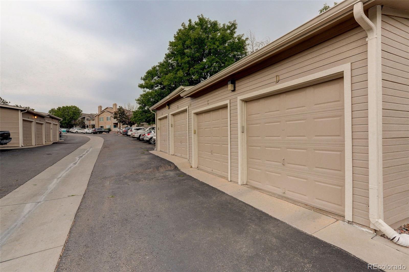 8415 Pebble Creek Way, Unit 203 Highlands Ranch, CO 80126 - Photo 25 of 36 a view of a car garage both side of the house