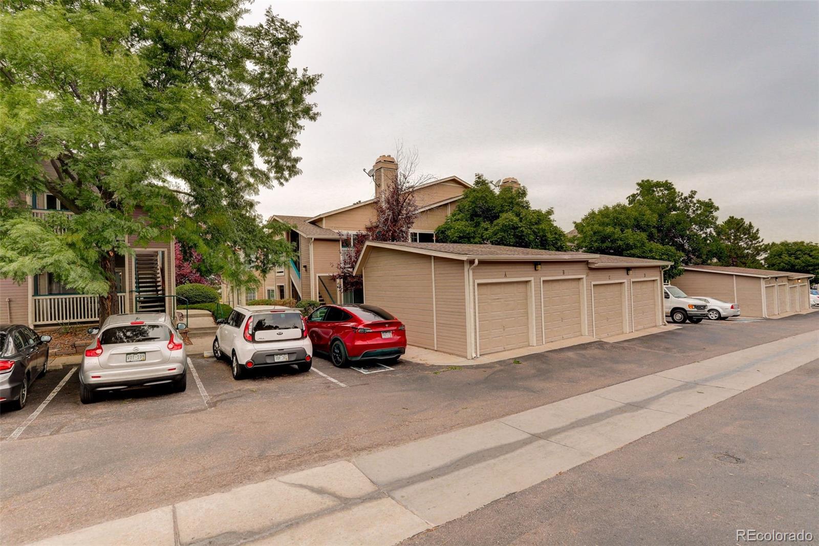 8415 Pebble Creek Way, Unit 203 Highlands Ranch, CO 80126 - Photo 26 of 36 a view of street with parked cars