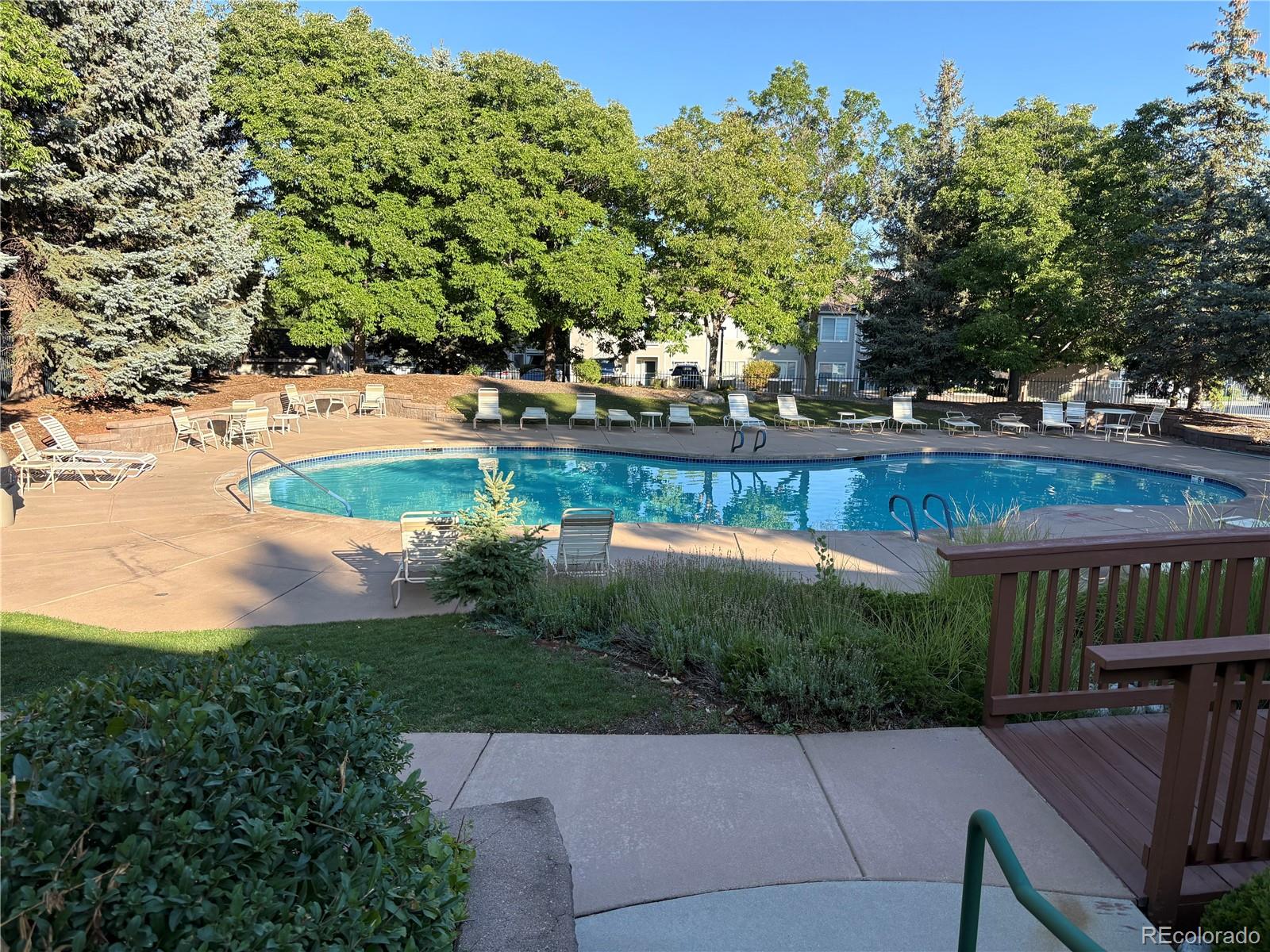 8415 Pebble Creek Way, Unit 203 Highlands Ranch, CO 80126 - Photo 30 of 36 a view of a backyard with sitting area