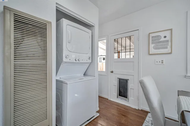 a hallway with a washer and dryer