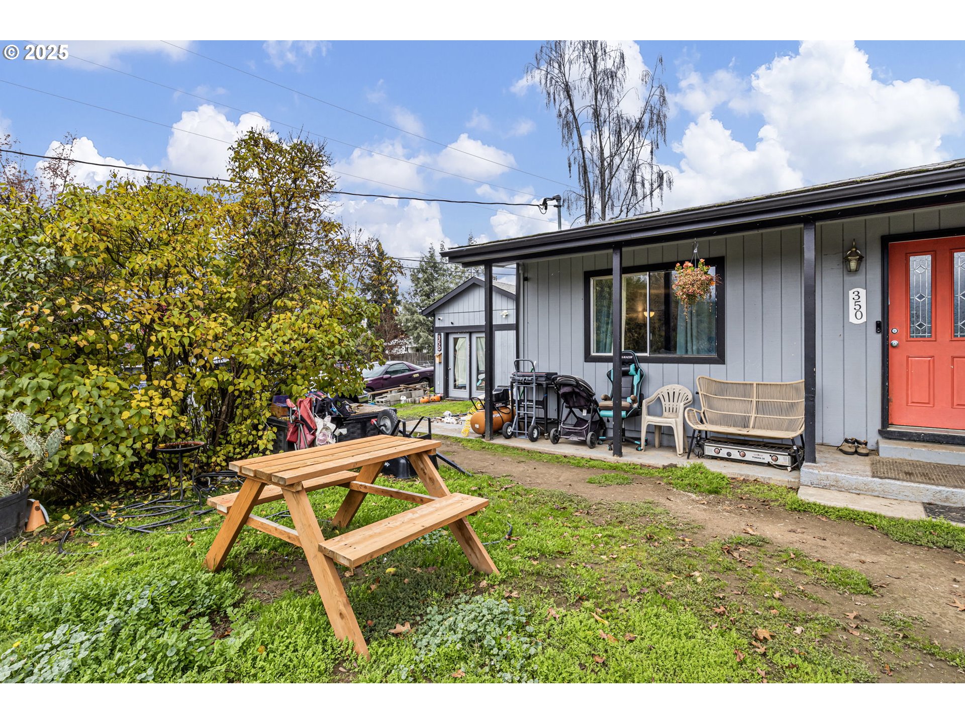 350 Park Street Winston, OR 97496 - Photo 19 of 25 a view of a house with backyard sitting area and garden