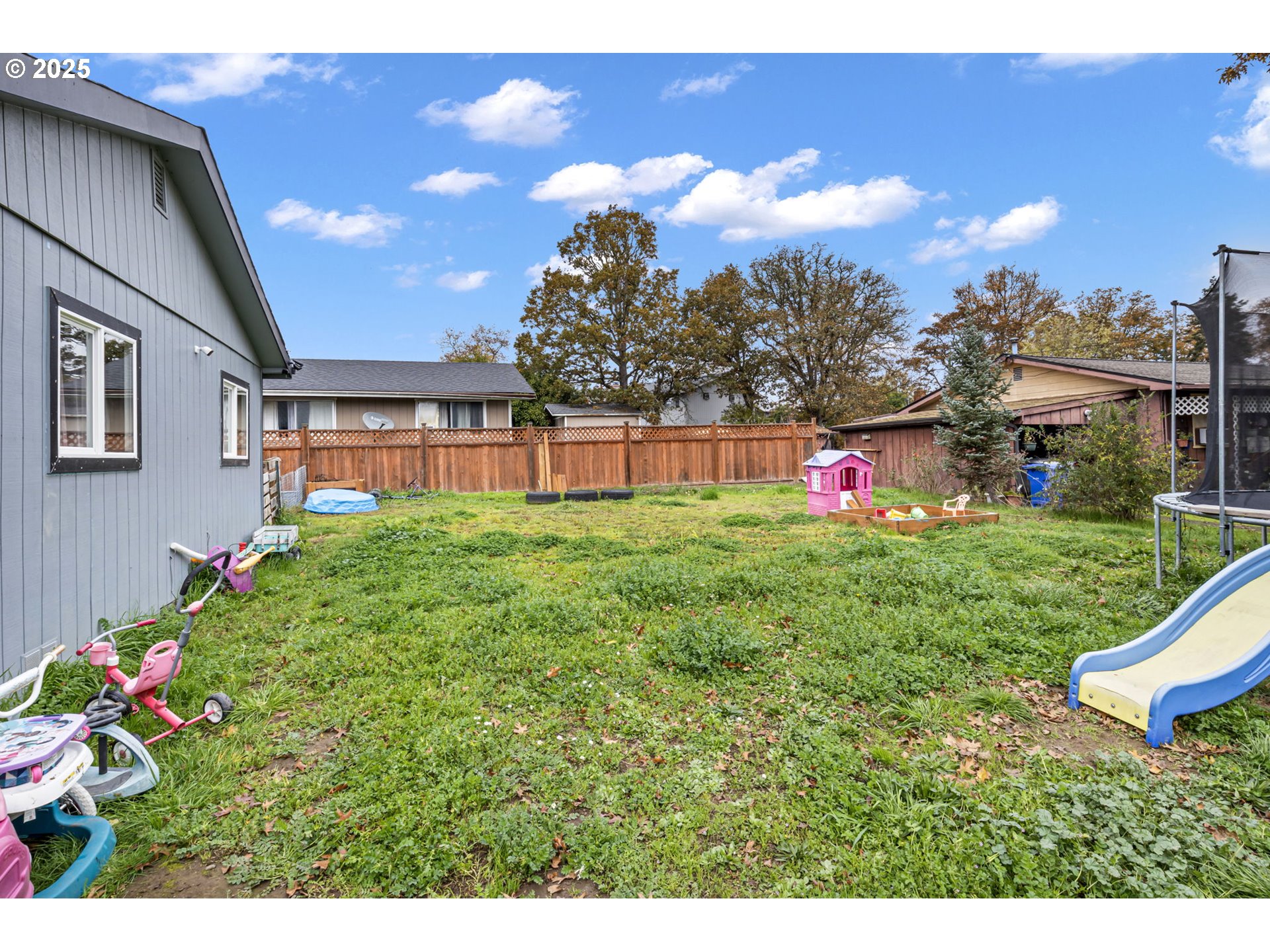 350 Park Street Winston, OR 97496 - Photo 21 of 25 a view of a house with a backyard and a garden