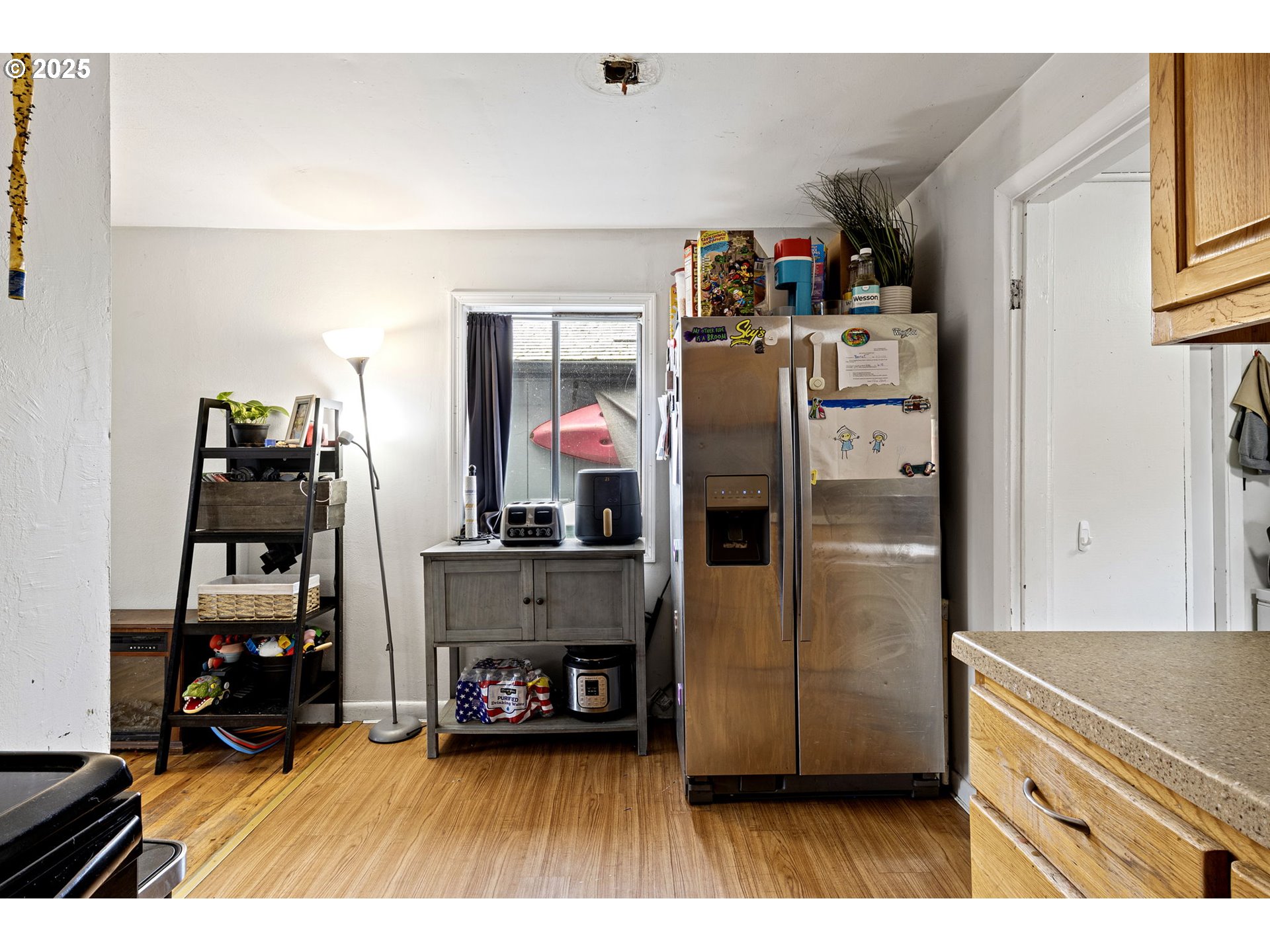 350 Park Street Winston, OR 97496 - Photo 7 of 25 a kitchen with refrigerator and cabinets