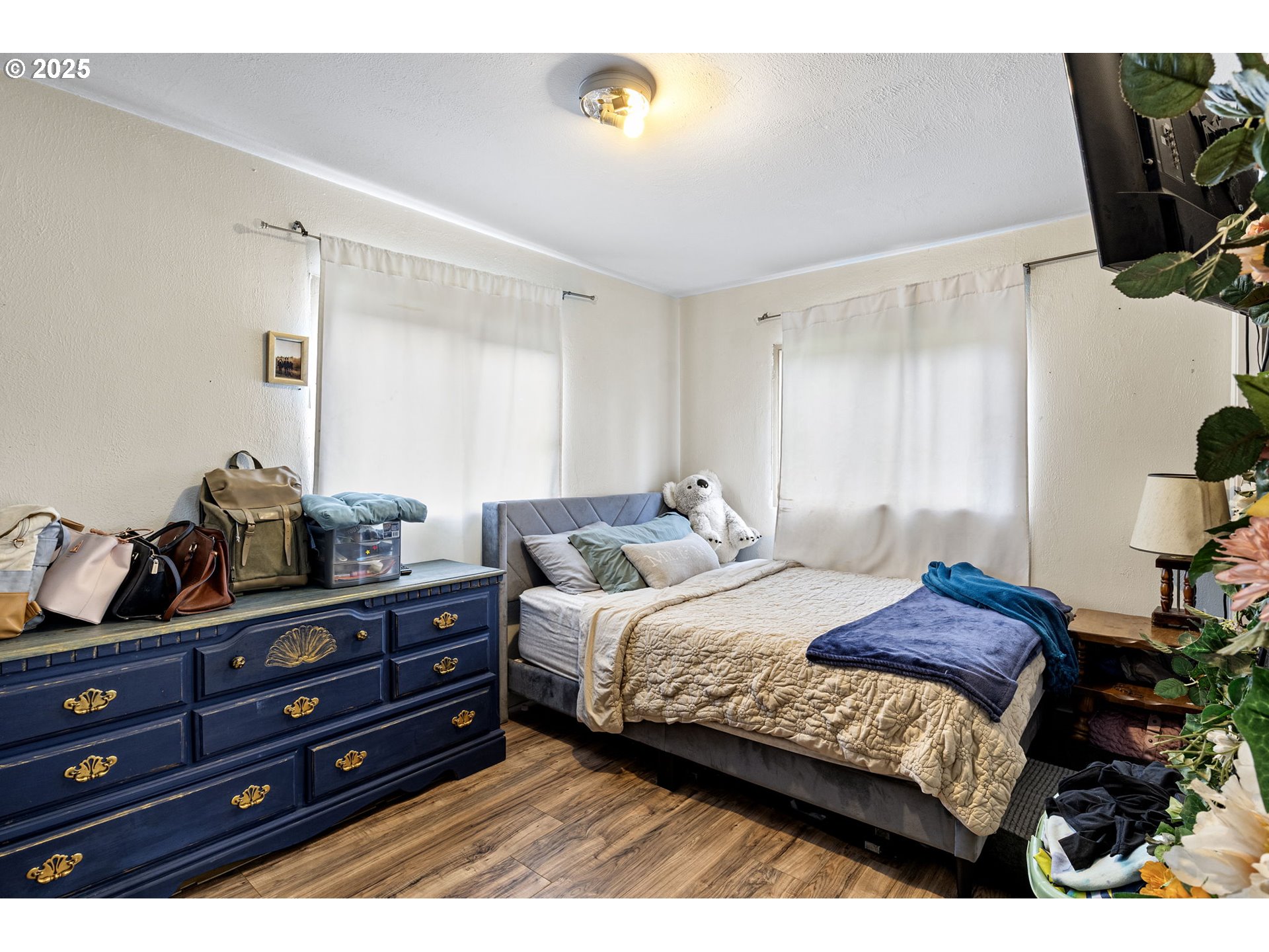 350 Park Street Winston, OR 97496 - Photo 10 of 25 a bedroom with a bed window and a flat screen tv