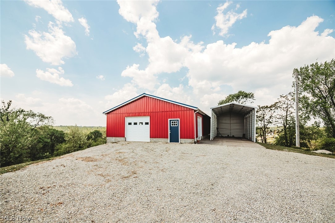 67810 Highway 124 Reedsville, OH 45772 - Photo 12 of 49 47x49 Garage, RV Parking with concrete pad, concrete floor, 1 front garage door, 1 side garage door, 1 entry door