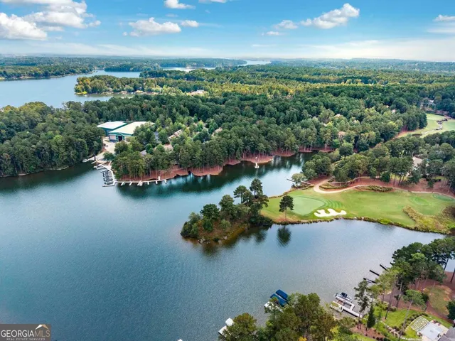 an aerial view of a house with a lake view