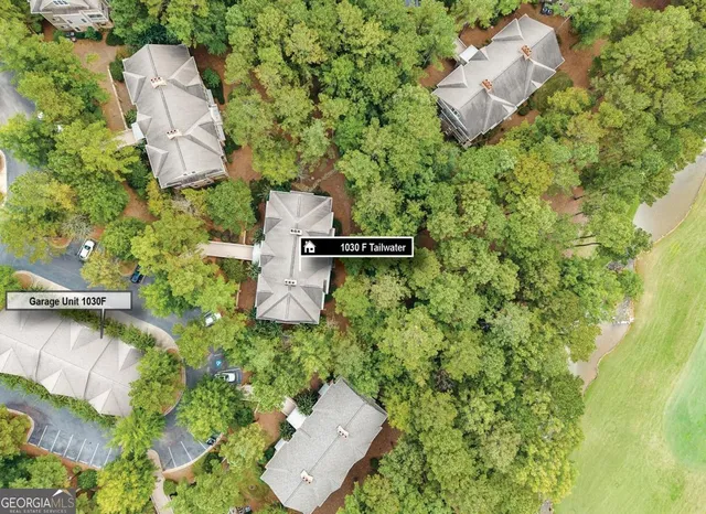 an aerial view of a house with swimming pool and outdoor space