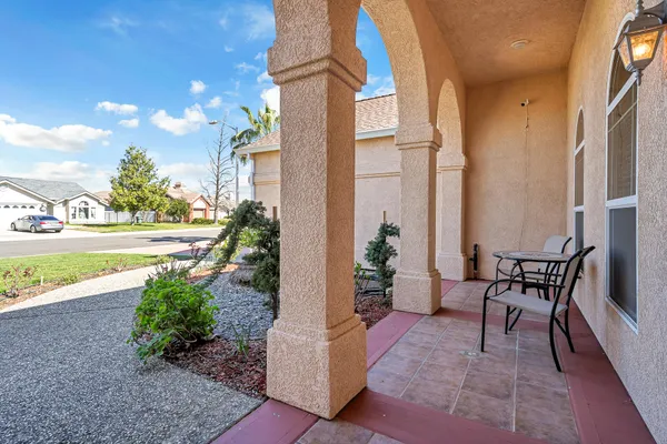 a kitchen with stainless steel appliances kitchen island granite countertop a refrigerator and a stove top oven