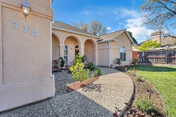a large kitchen with stainless steel appliances granite countertop a sink and a stove