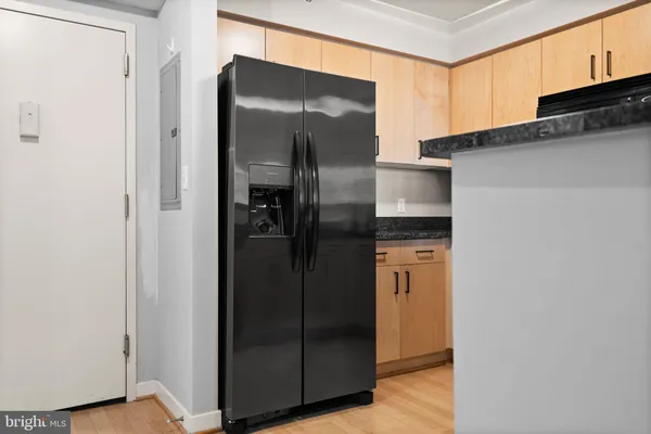 a kitchen with metallic refrigerator freezer and a dishwasher