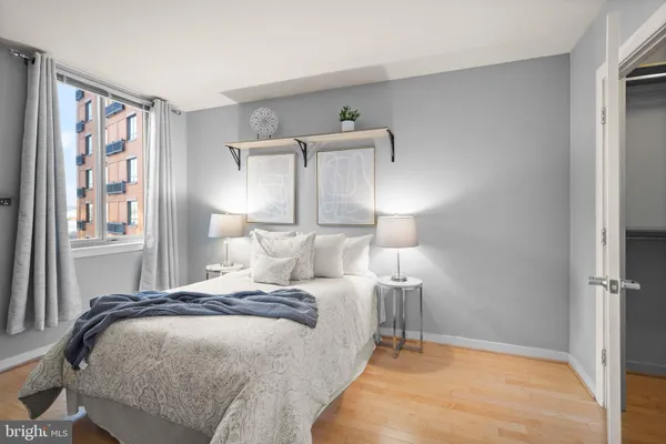 a bedroom with a bed and a window