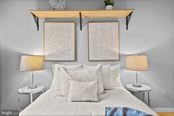 a bed room with a bed and a lamp