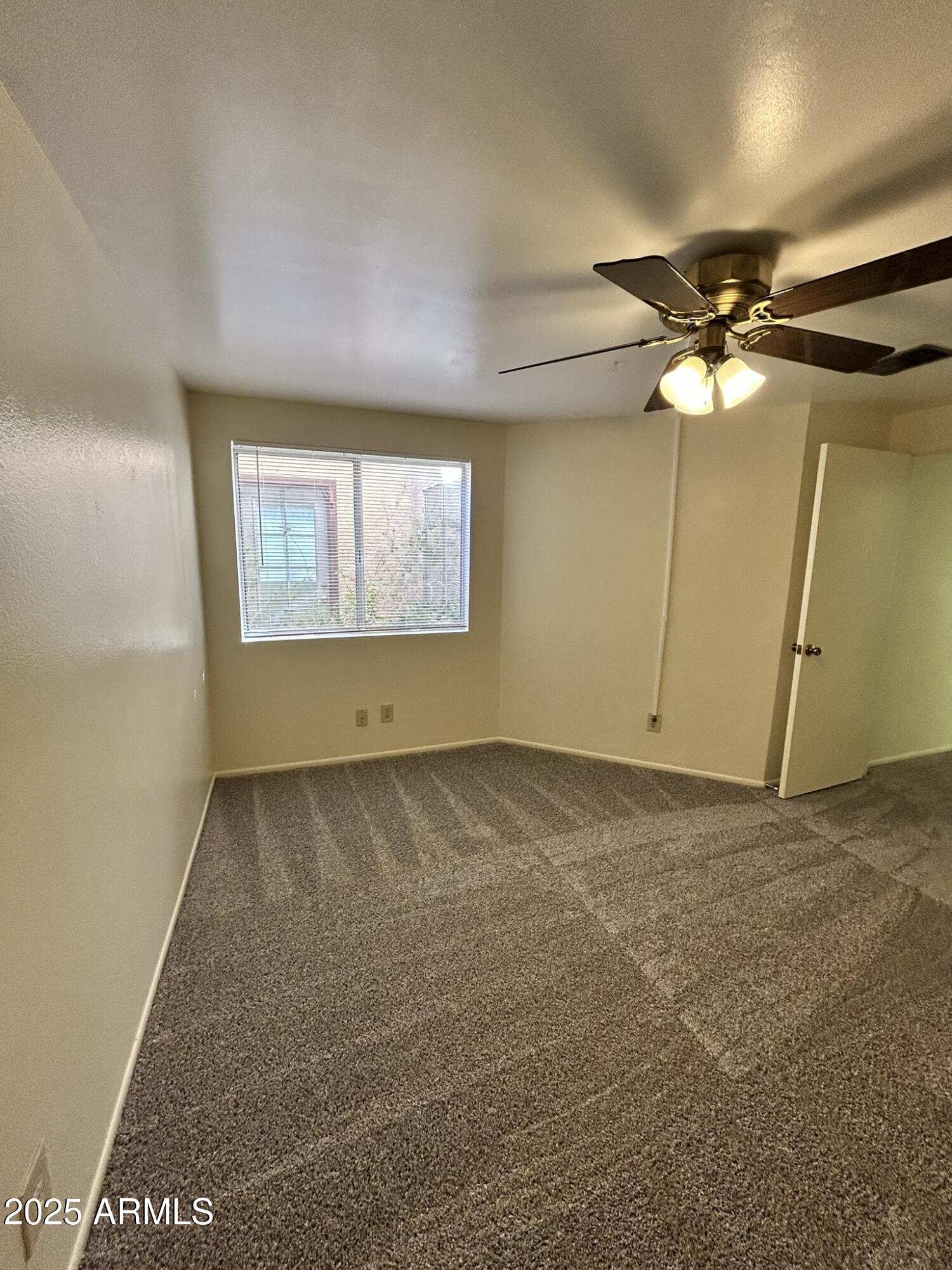 2120 North Yucca Court Chandler, AZ 85224 - Photo 21 of 32 a view of an empty room with a window