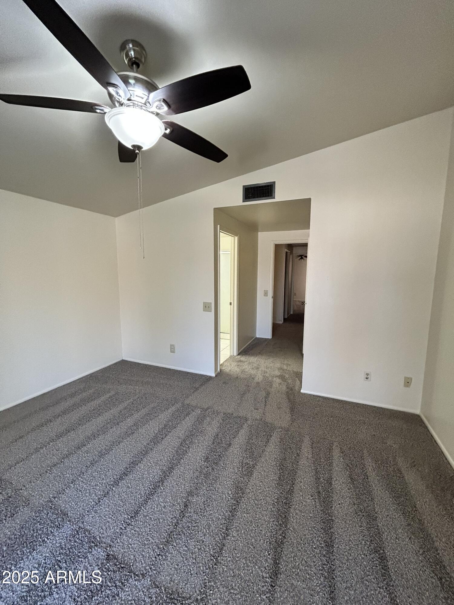 2120 North Yucca Court Chandler, AZ 85224 - Photo 28 of 32 a view of an empty room with wooden floor
