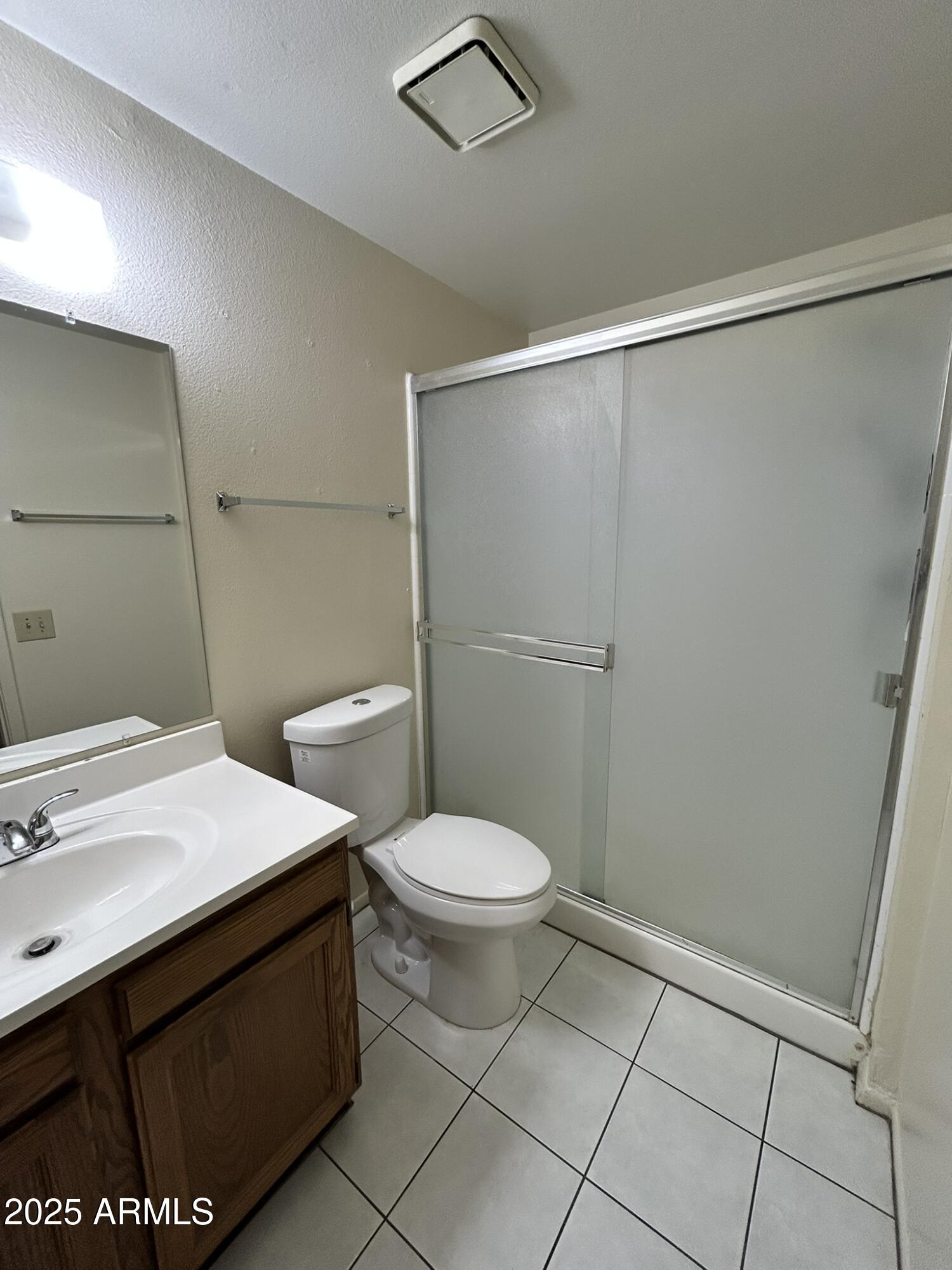 2120 North Yucca Court Chandler, AZ 85224 - Photo 29 of 32 a bathroom with a sink a toilet and a shower