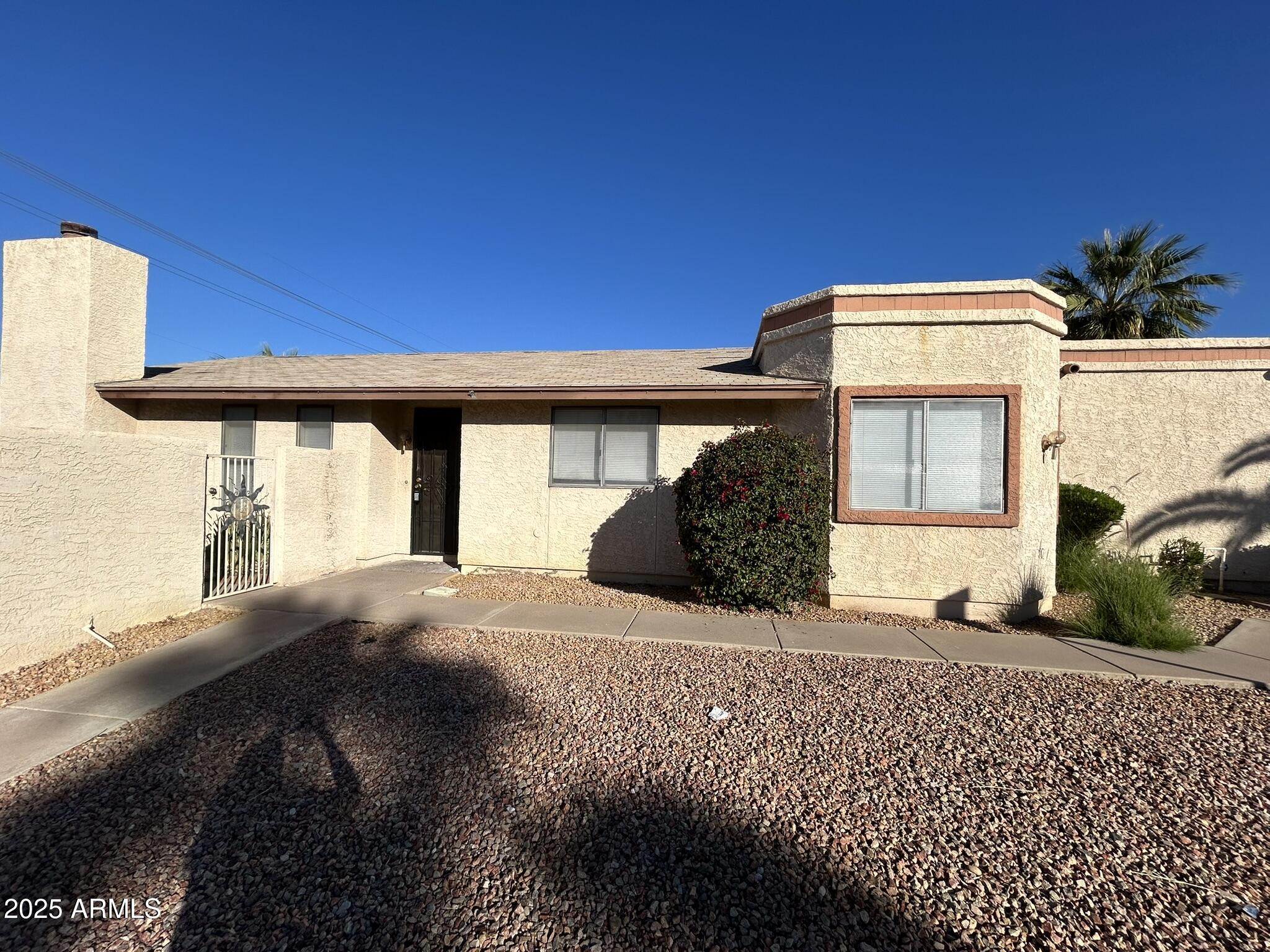 2120 North Yucca Court Chandler, AZ 85224 - Photo 3 of 32 a front view of a house with a yard