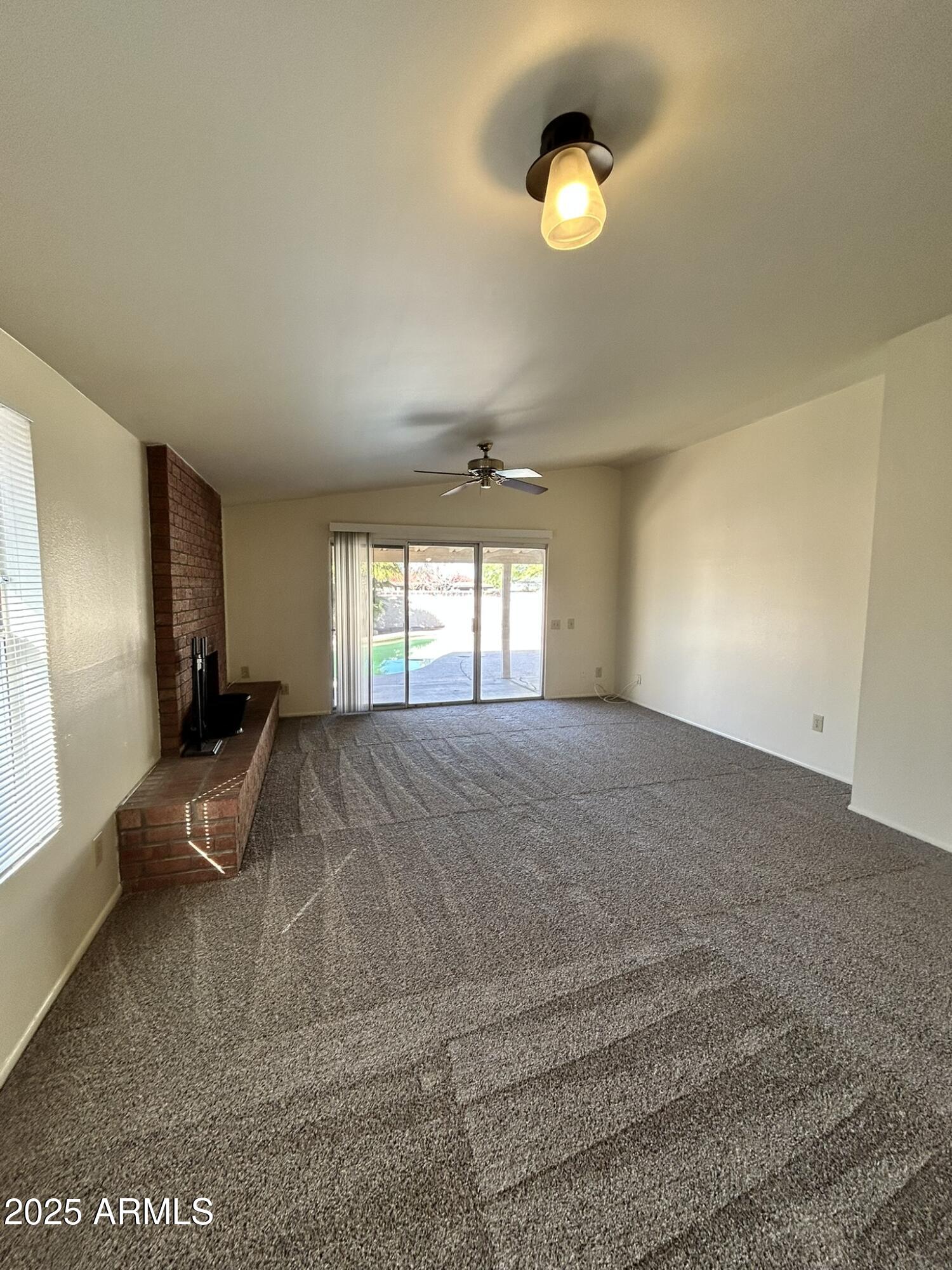 2120 North Yucca Court Chandler, AZ 85224 - Photo 7 of 32 a spacious bedroom with a large bed and a chandelier