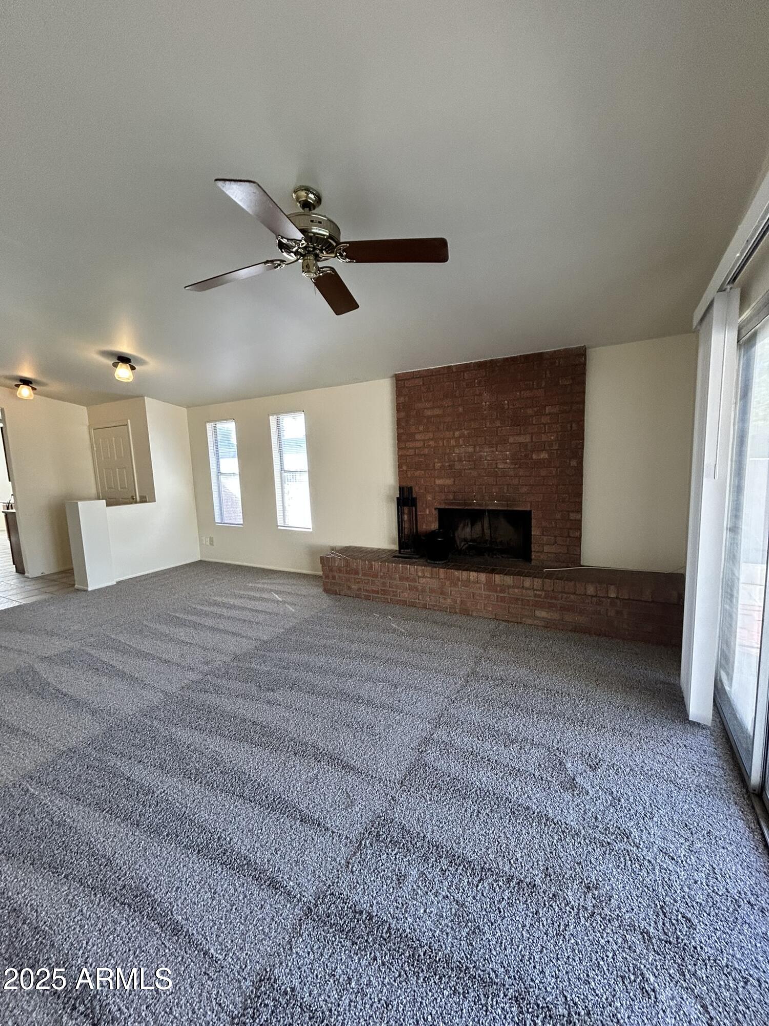2120 North Yucca Court Chandler, AZ 85224 - Photo 9 of 32 a view of a livingroom with a fireplace