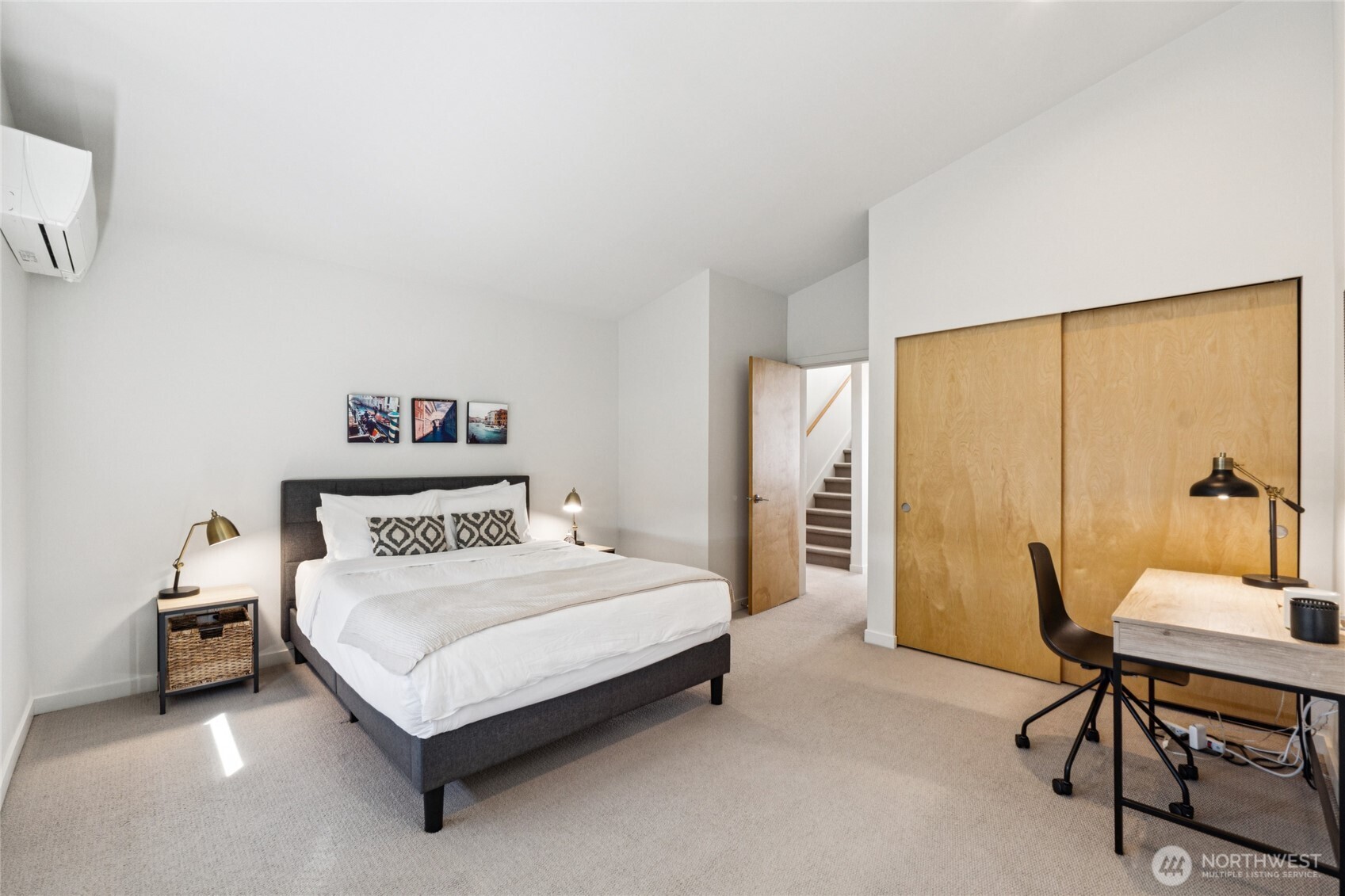 1432 South King Street Seattle, WA 98144 - Photo 11 of 28 a bedroom with a bed and a table in it