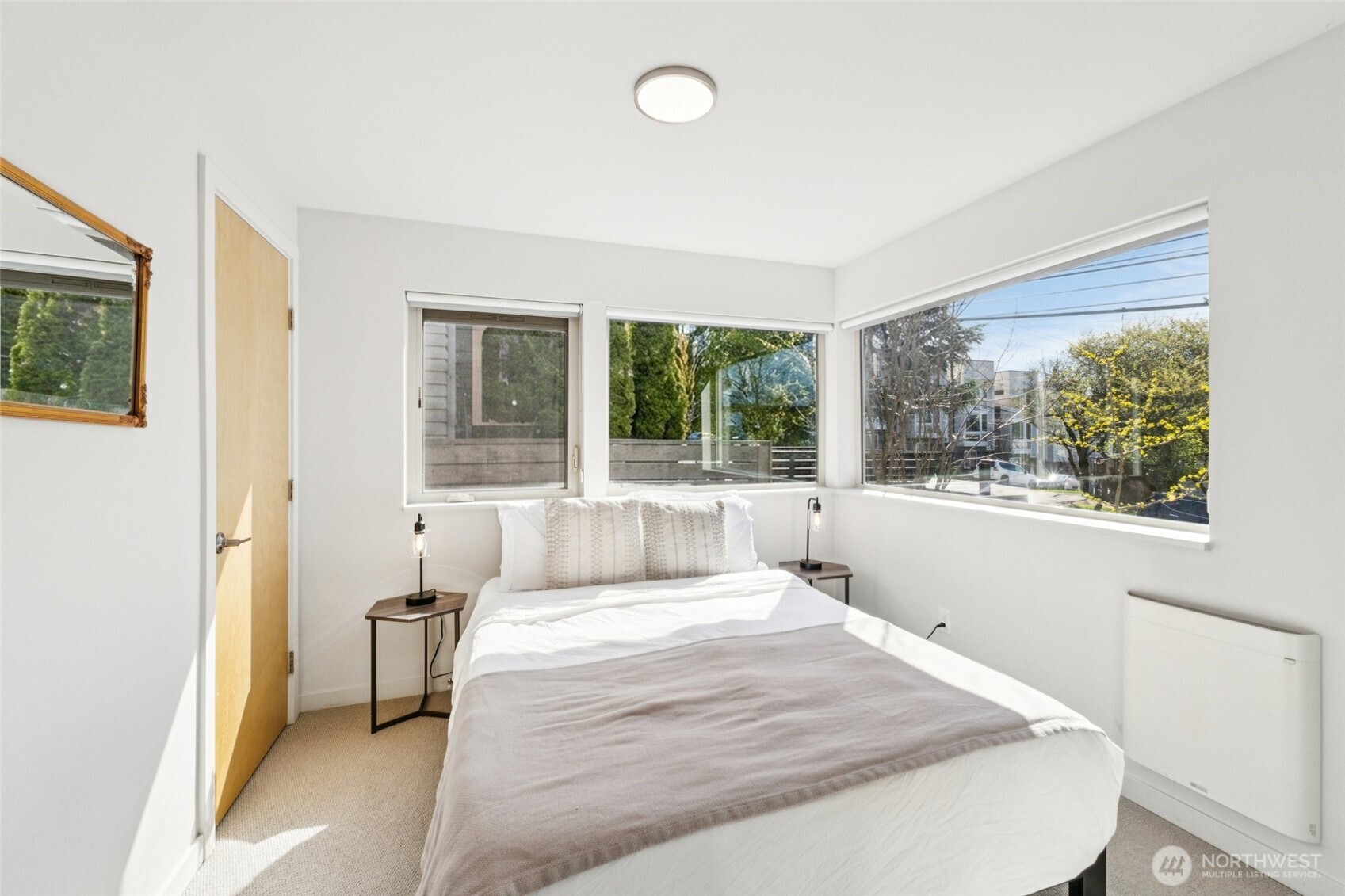 1432 South King Street Seattle, WA 98144 - Photo 16 of 28 a bedroom with a bed and a large window