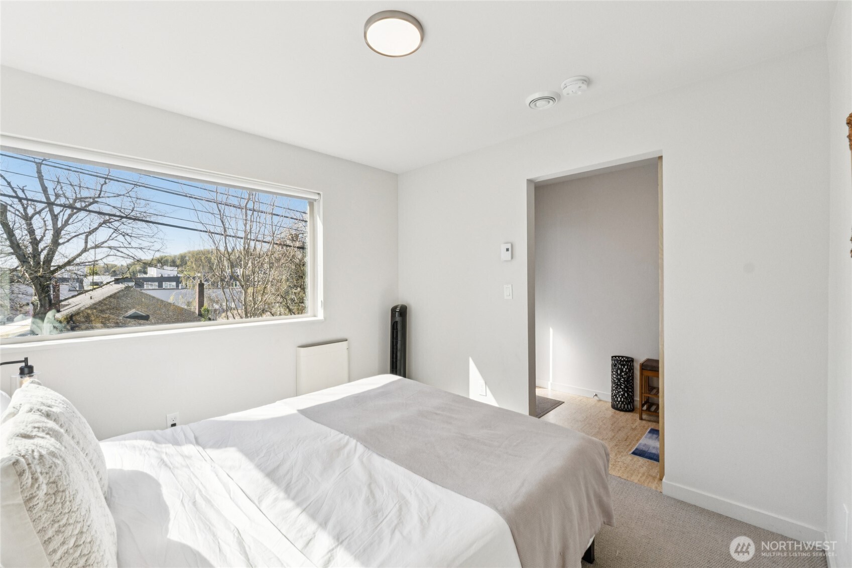 1432 South King Street Seattle, WA 98144 - Photo 17 of 28 a bedroom with a bed and a window