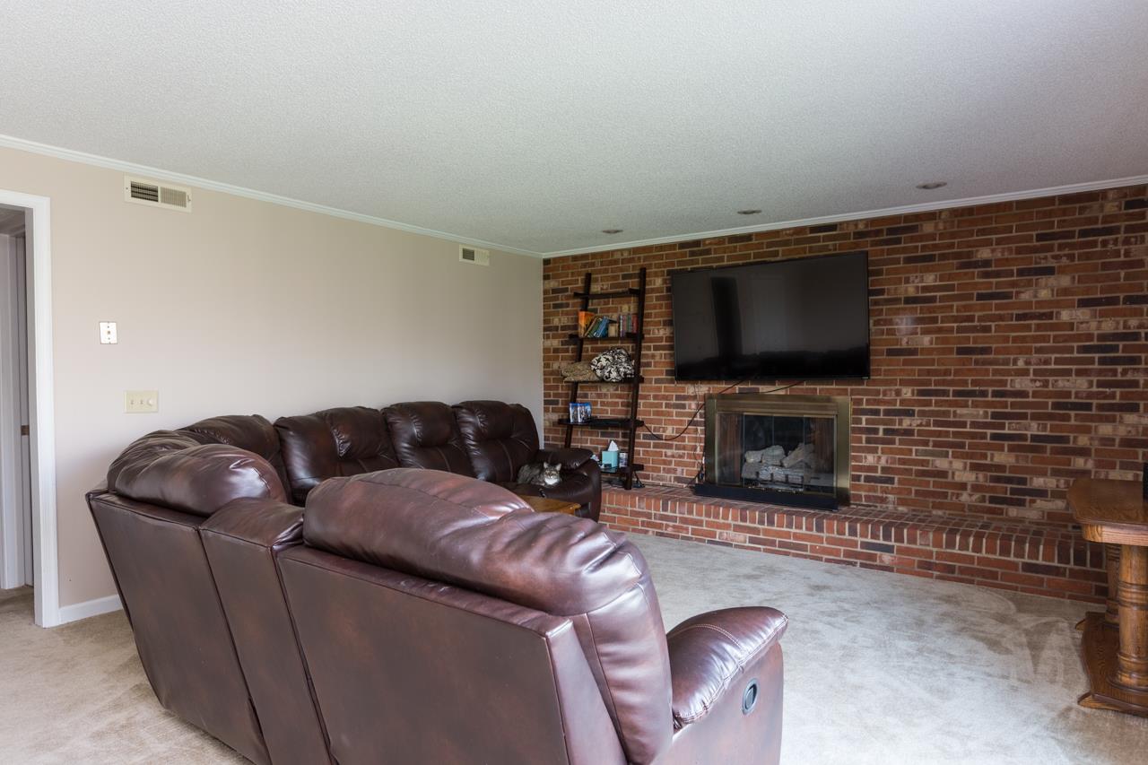 165 Rorrer Circle Harrisonburg, VA 22801 - Photo 16 of 27 The floor-to-ceiling, wall-to-wall brick hearth makes the room feel cozy and provides a striking focal point to the space.