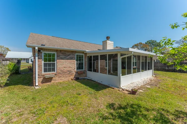 a view of a house with garden and yard
