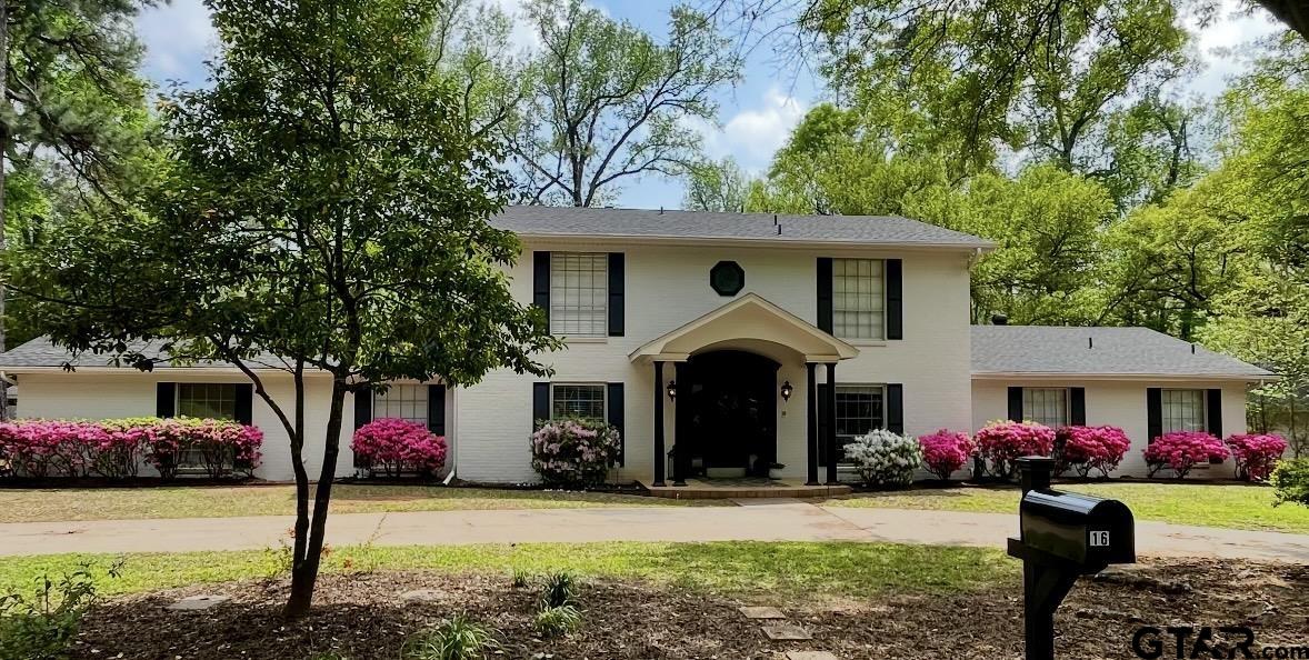 16 Pegues Place Longview, TX 75601 - Photo 1 of 45 a front view of a house with yard