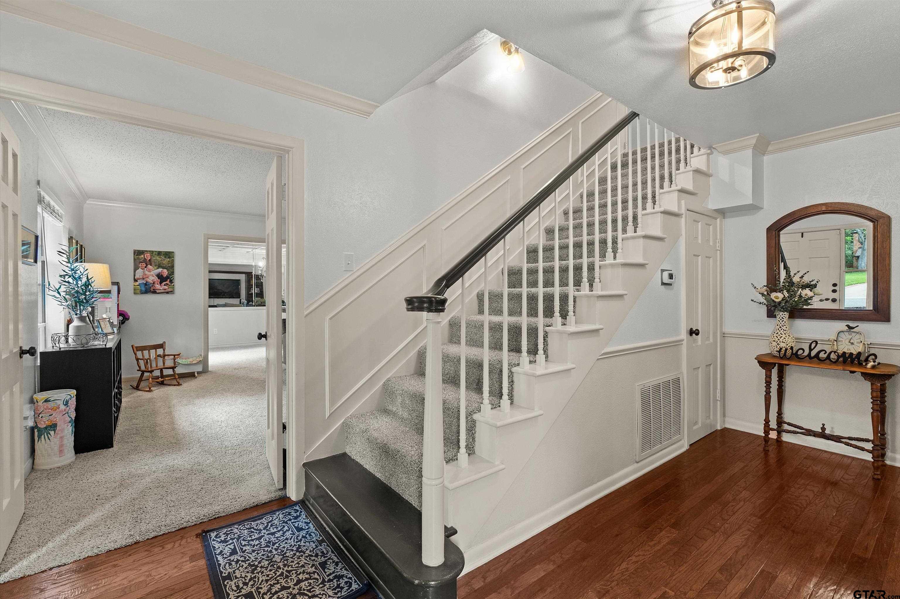 16 Pegues Place Longview, TX 75601 - Photo 12 of 45 a view of entryway and hall with wooden floor