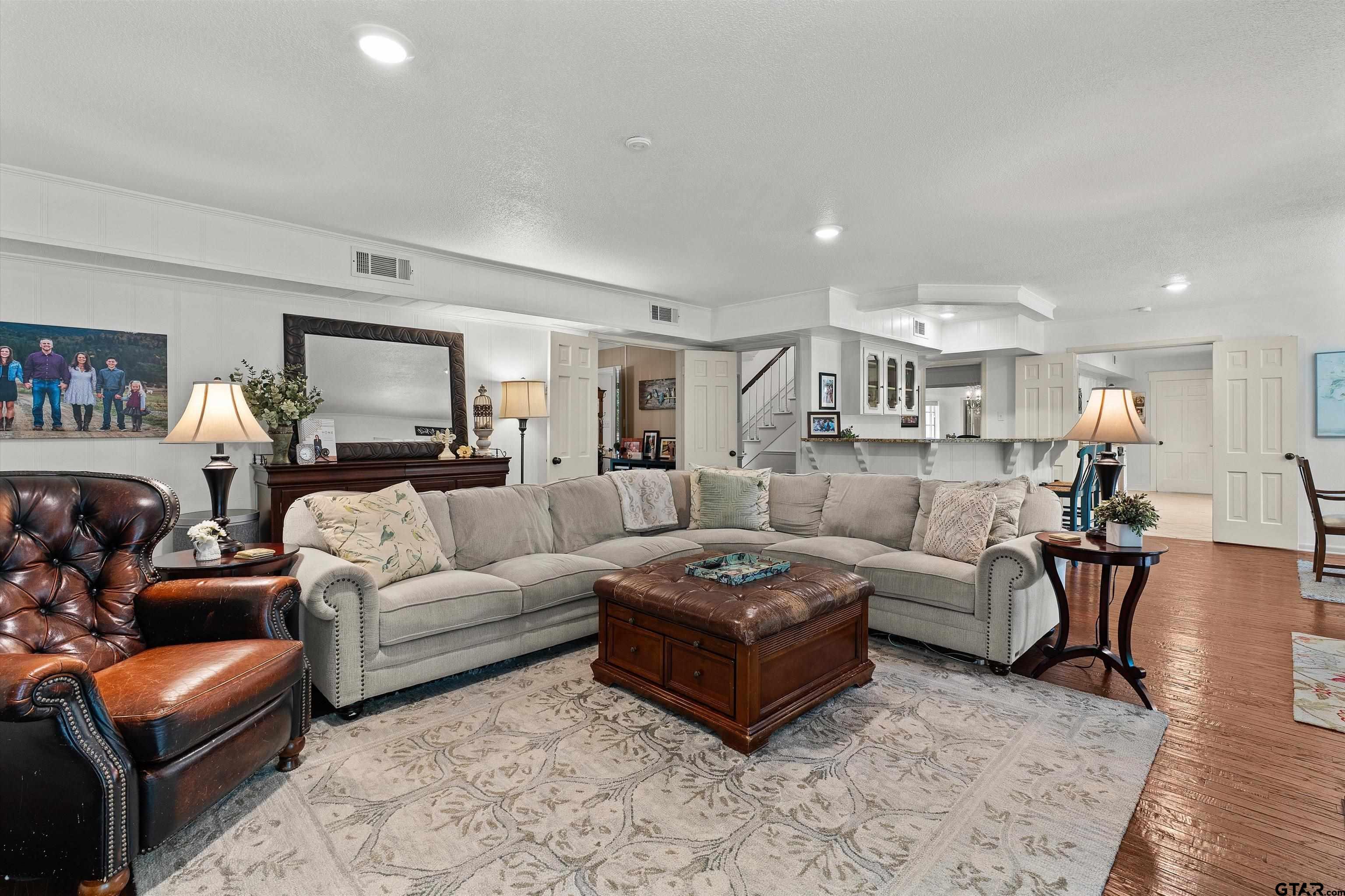 16 Pegues Place Longview, TX 75601 - Photo 15 of 45 a living room with furniture and wooden floor