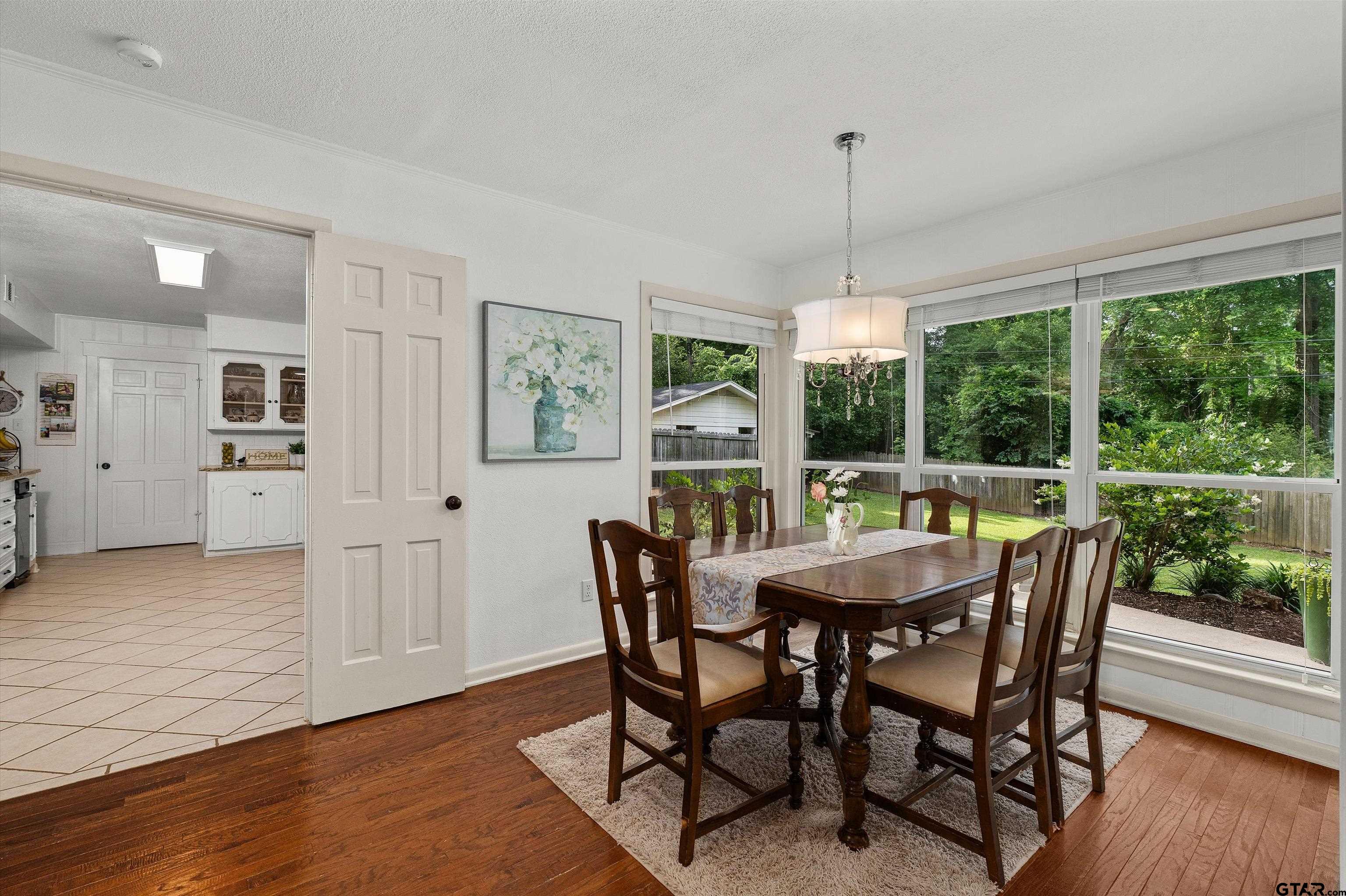 16 Pegues Place Longview, TX 75601 - Photo 17 of 45 a dining room with furniture window wooden floor
