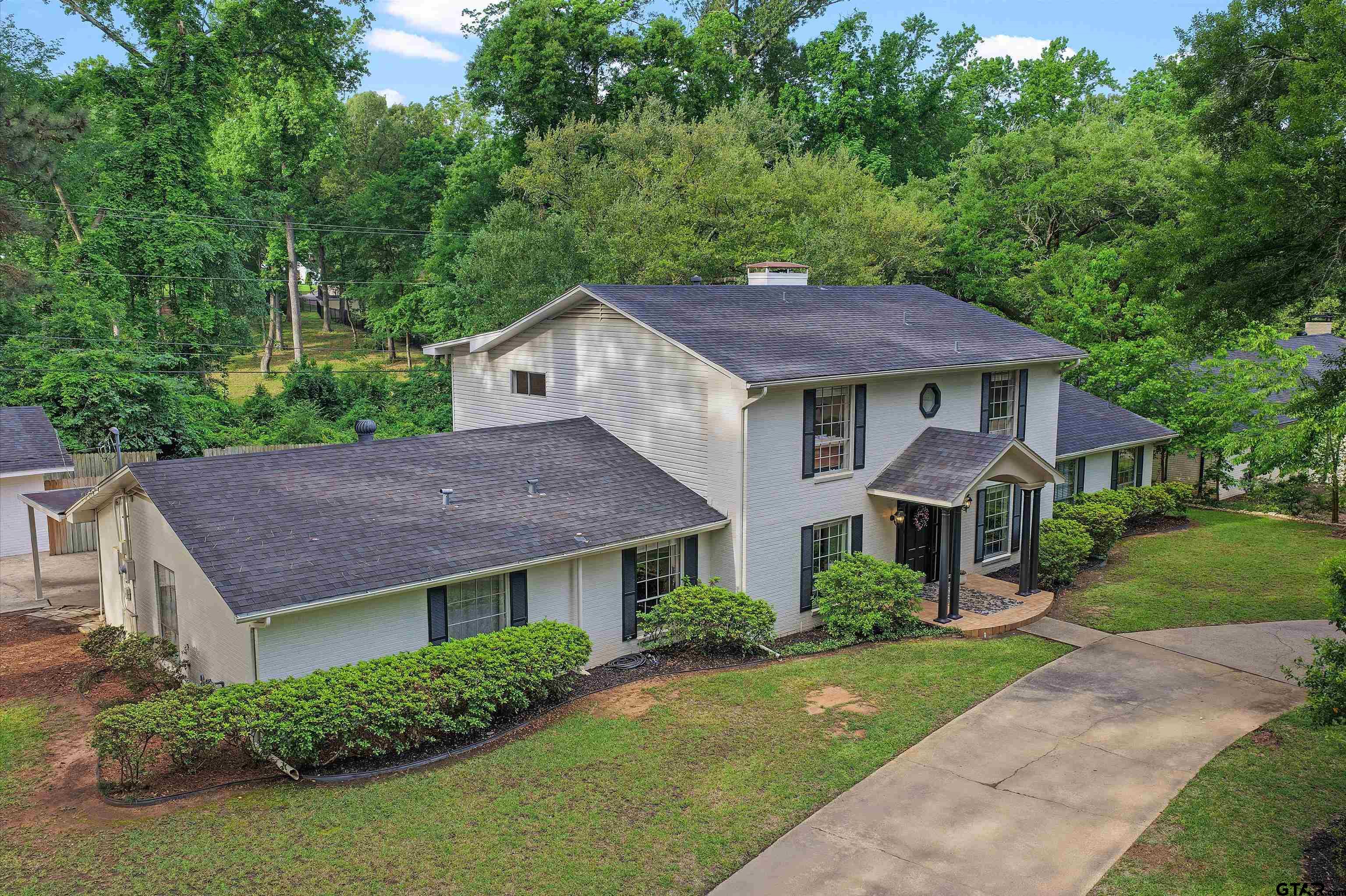 16 Pegues Place Longview, TX 75601 - Photo 2 of 45 a house that has a tree in it