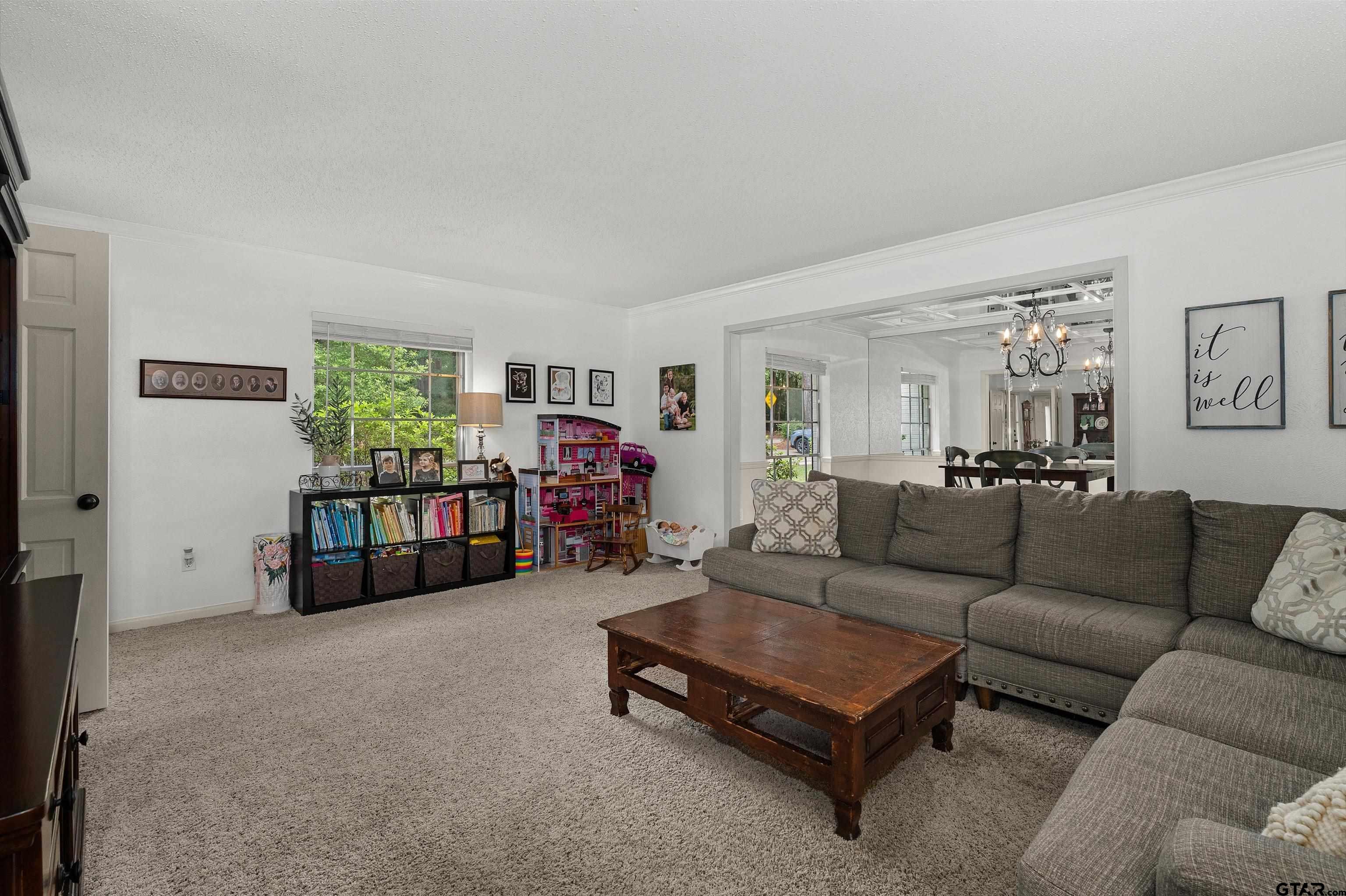 16 Pegues Place Longview, TX 75601 - Photo 23 of 45 a living room with furniture and a couch