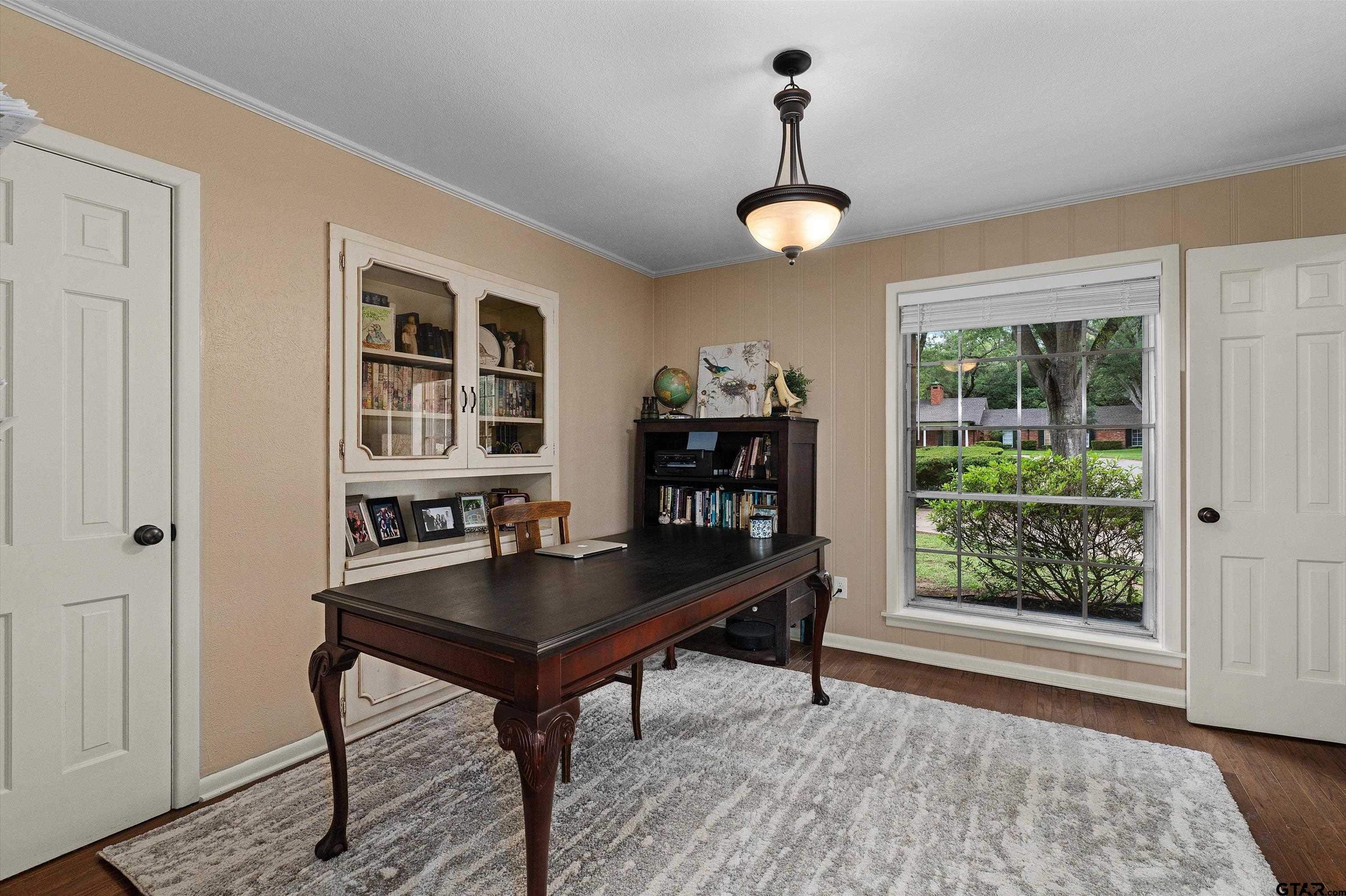 16 Pegues Place Longview, TX 75601 - Photo 24 of 45 a view of a workspace with furniture and a window