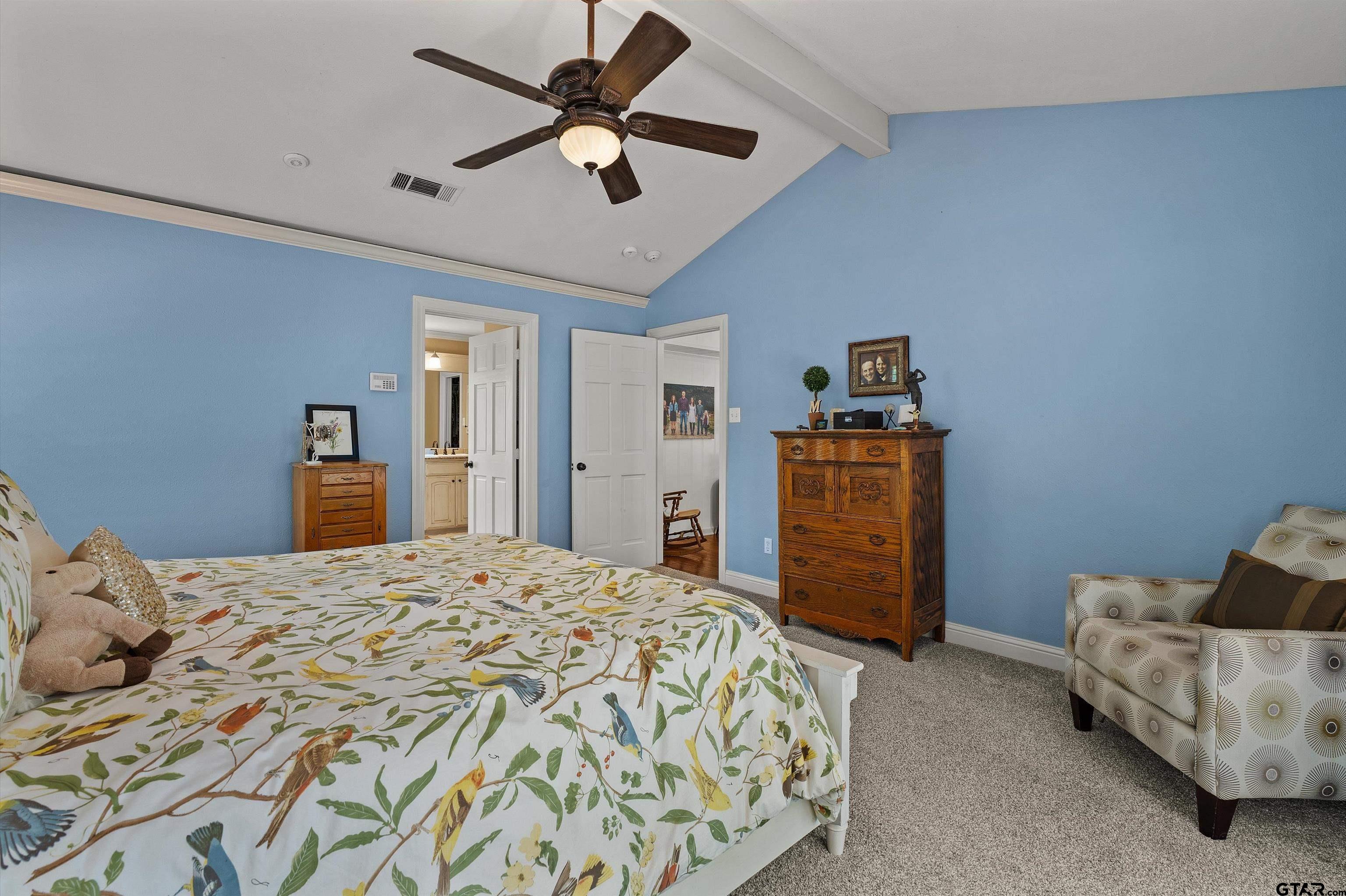 16 Pegues Place Longview, TX 75601 - Photo 26 of 45 a bedroom with a bed and a couch