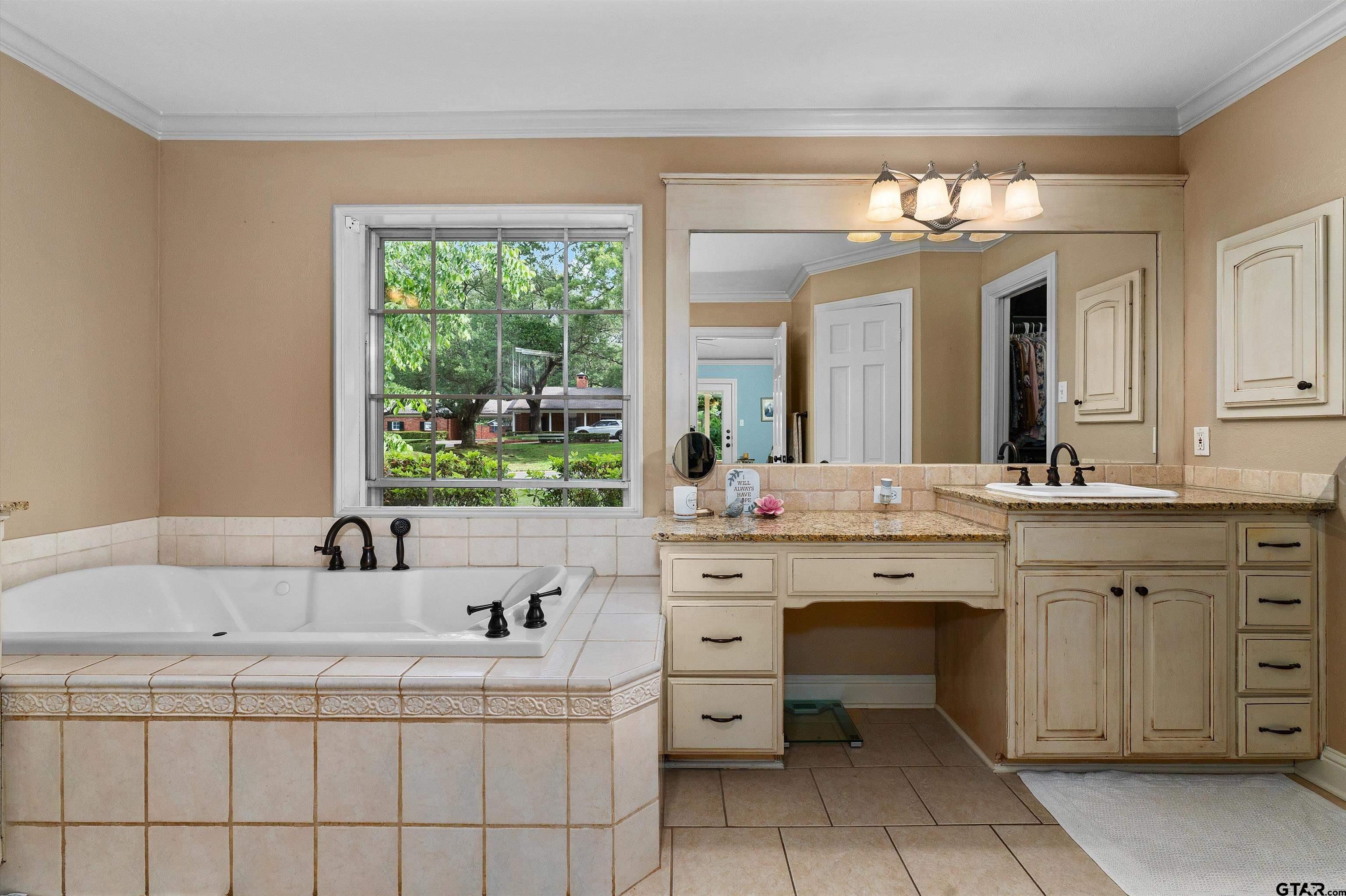 16 Pegues Place Longview, TX 75601 - Photo 28 of 45 a bathroom with a sink vanity and mirror