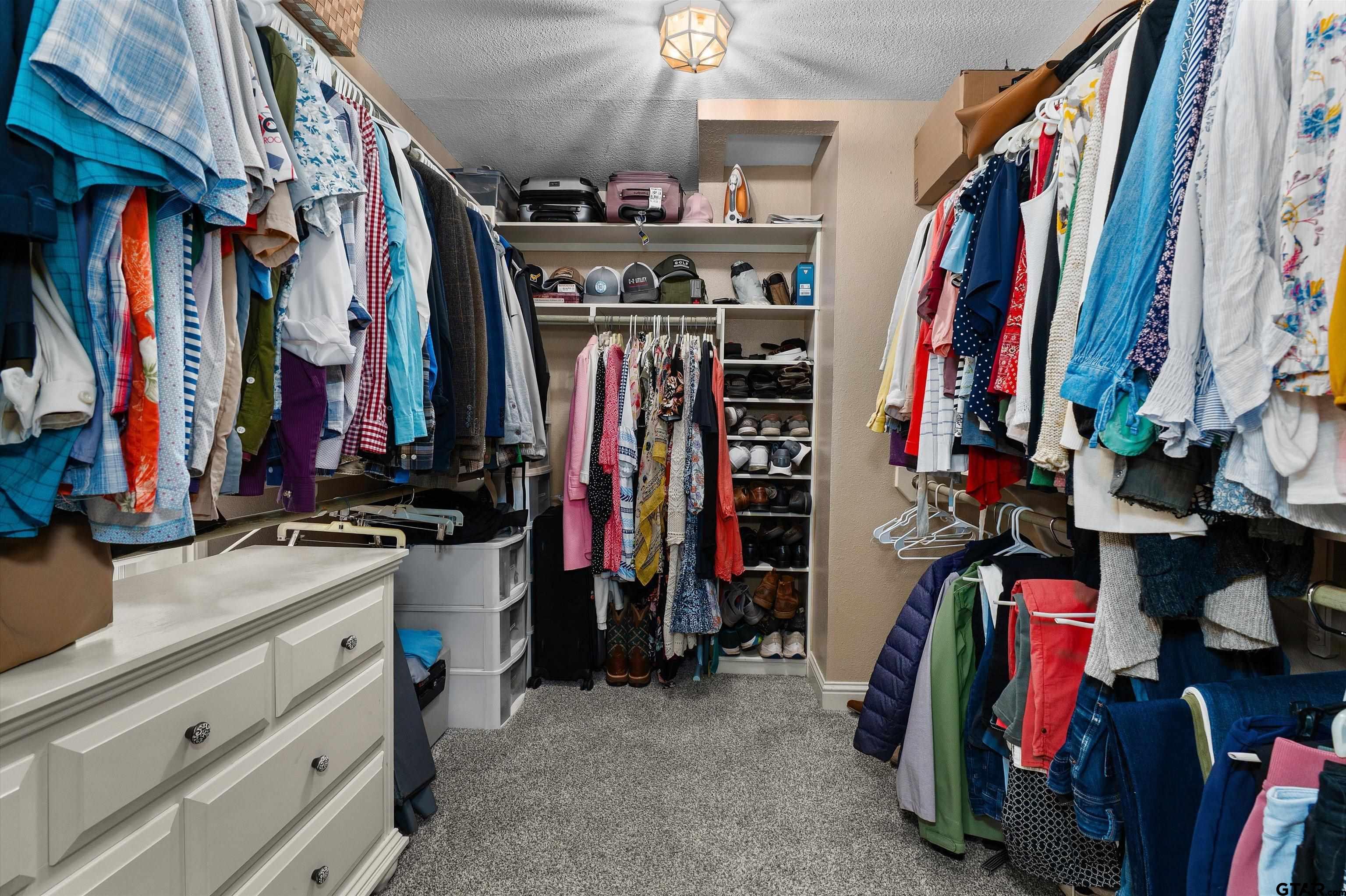 16 Pegues Place Longview, TX 75601 - Photo 29 of 45 a view of walk in closet with clothes