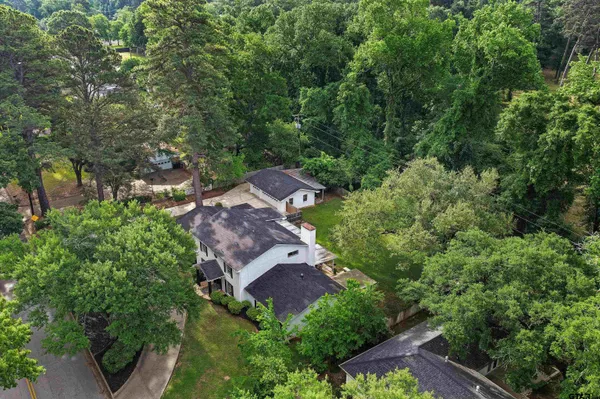 an aerial view of a house with a yard