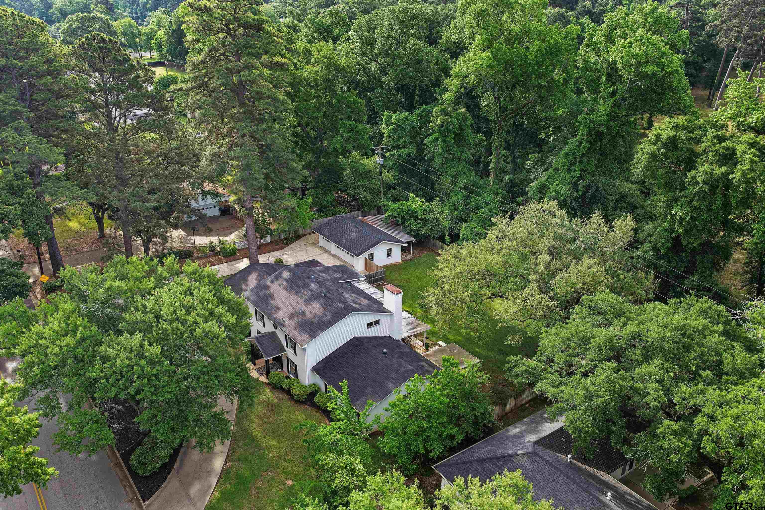 16 Pegues Place Longview, TX 75601 - Photo 3 of 45 an aerial view of a house with a yard